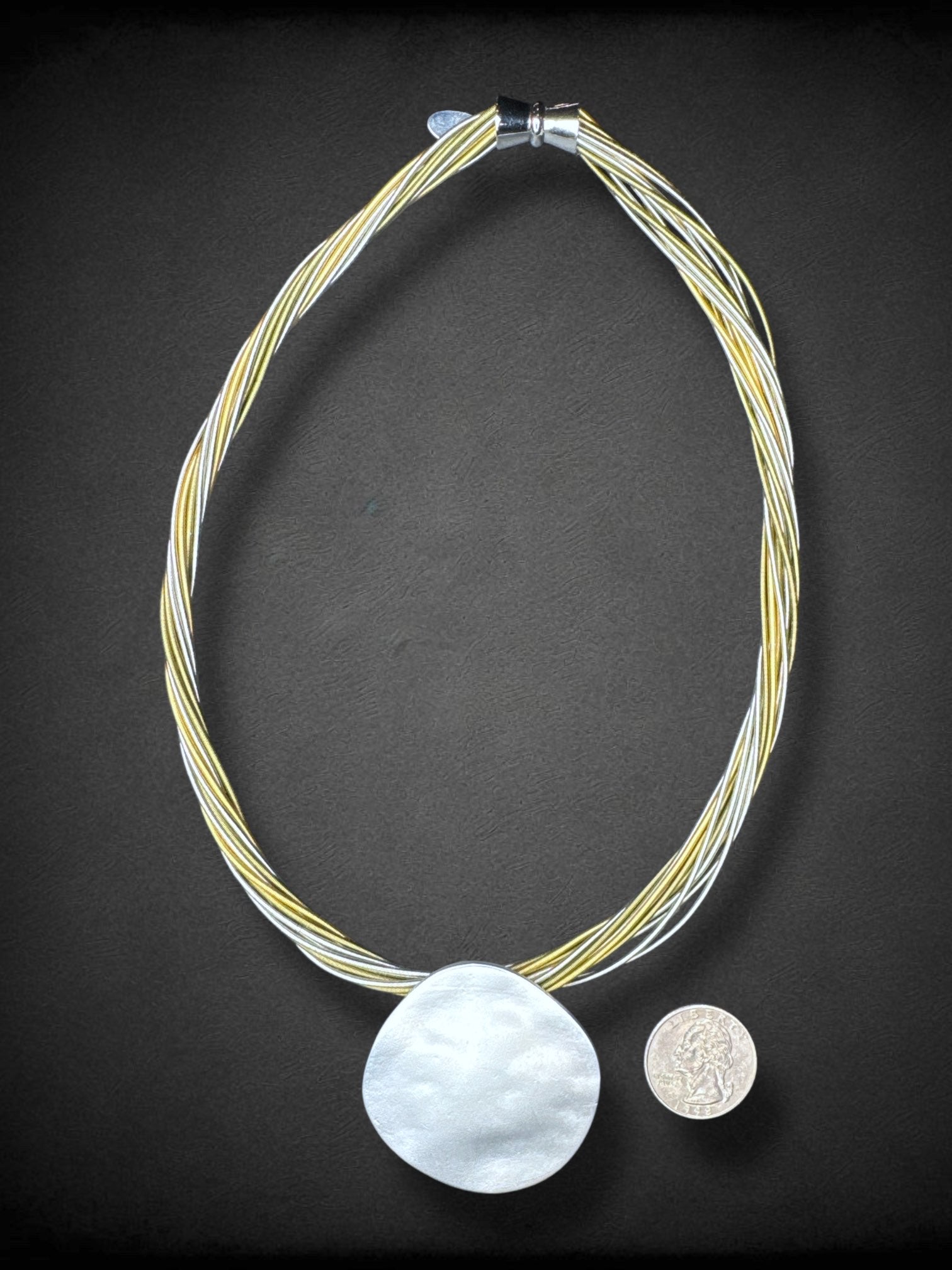 Sea Lily piano wire necklace with hammered silver tone pendant