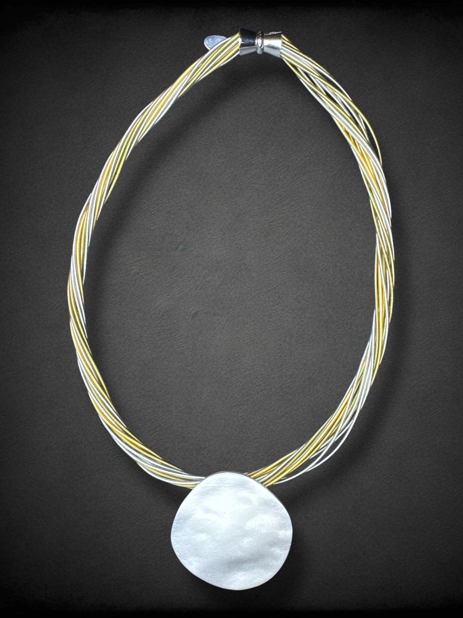 Sea Lily piano wire necklace with hammered silver tone pendant