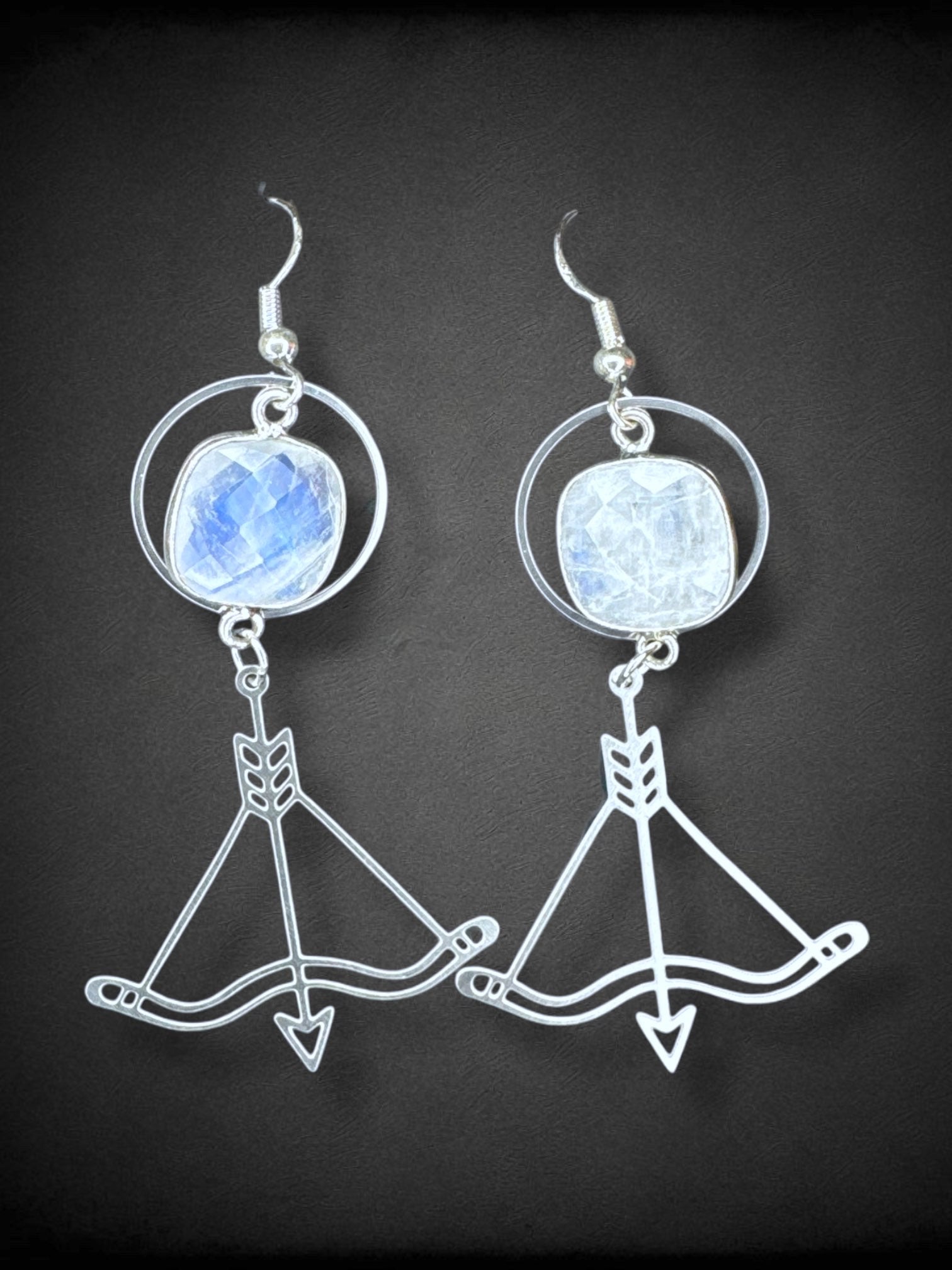 Silver tone bow and arrow earrings with big rhinestones