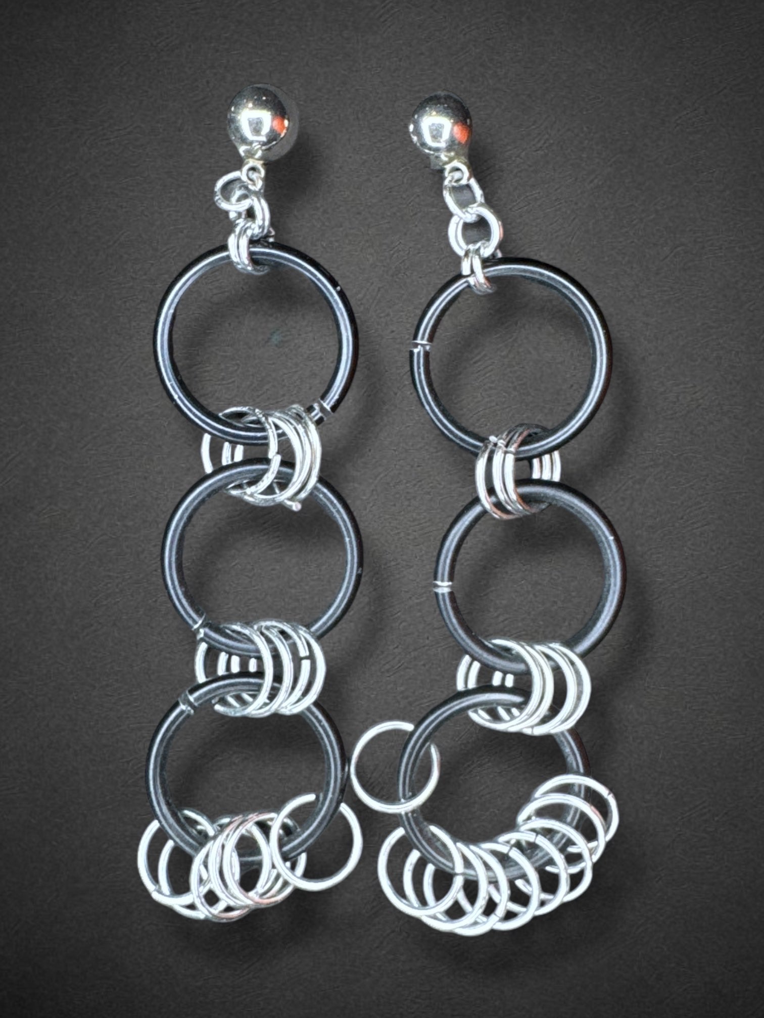 Black o ring earrings with metal hoops