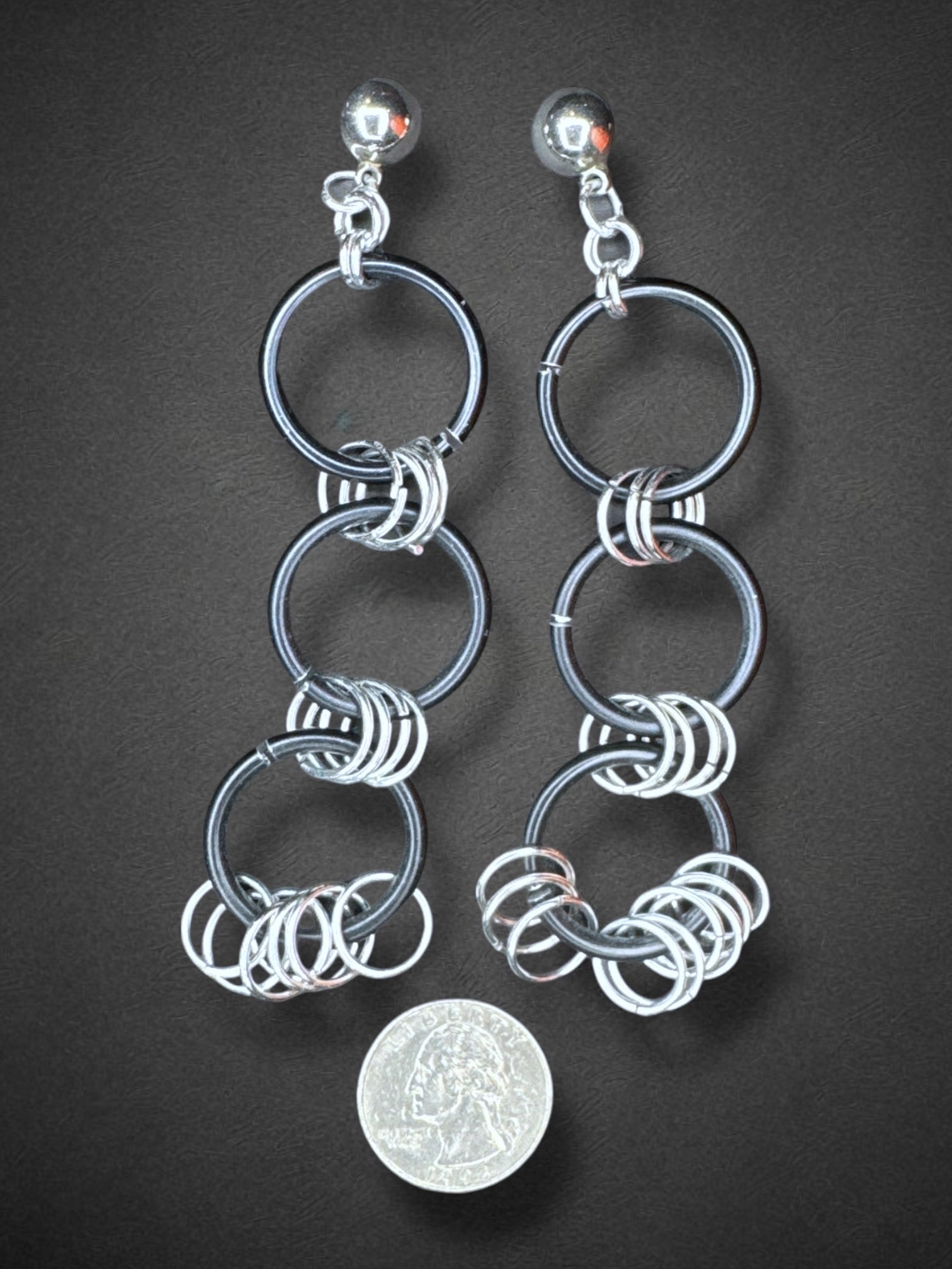 Black o ring earrings with metal hoops