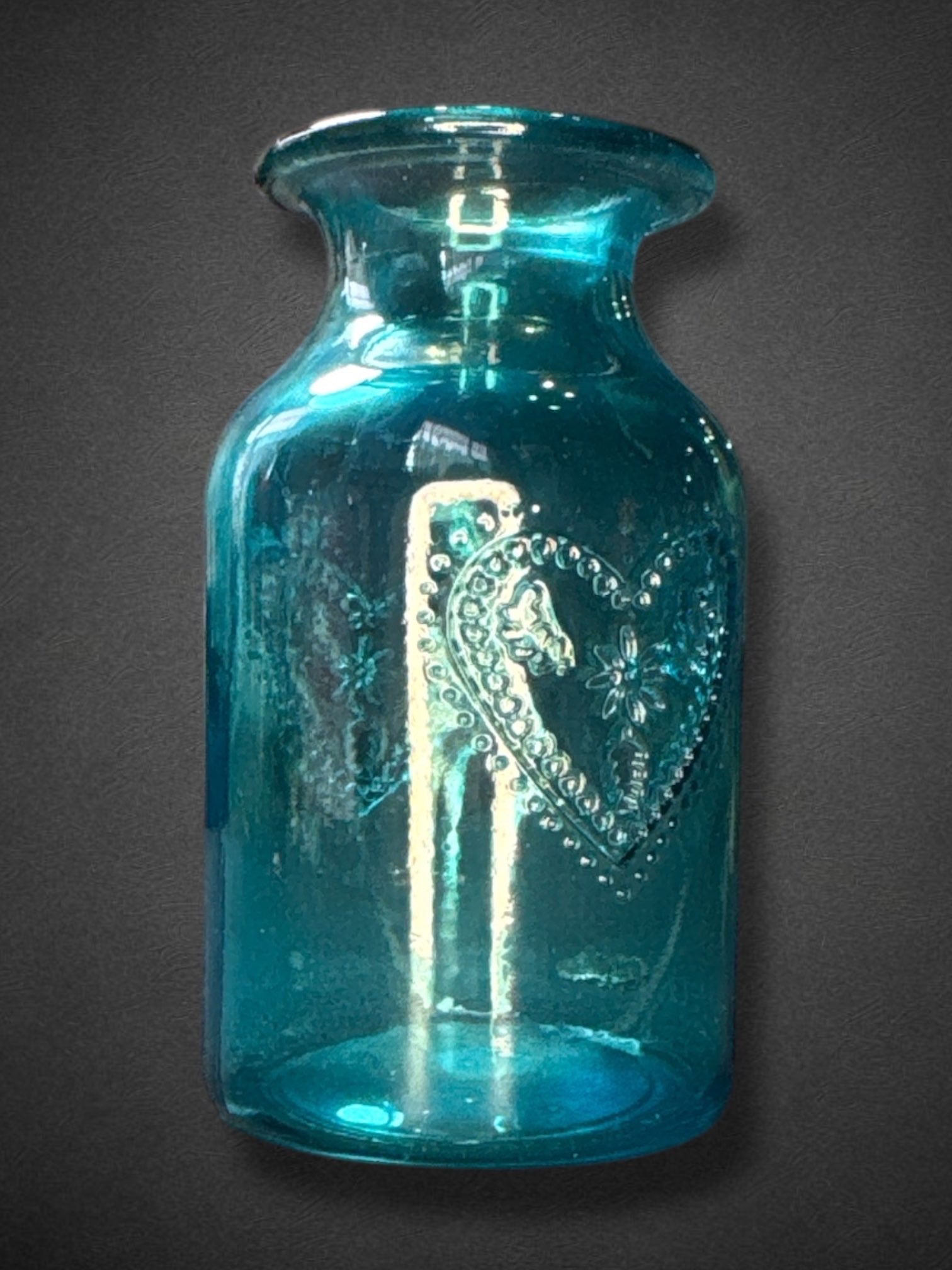 6” by 3” blue glass jar with hearts