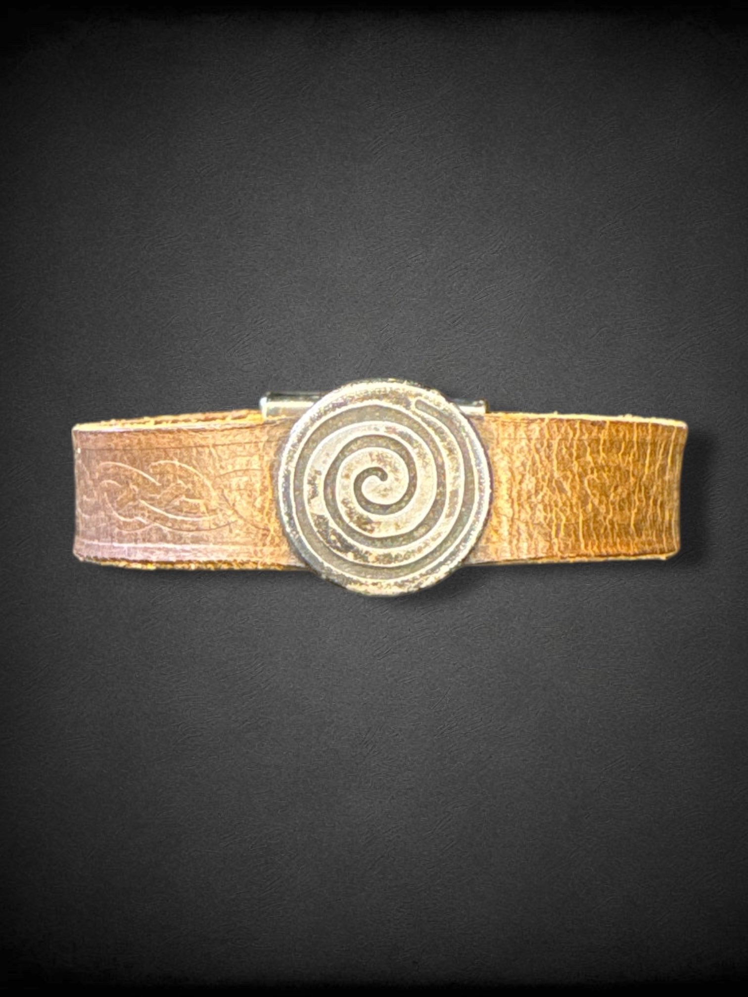 Leather bracelet with Celtic knot embossing and swirl metal pendant handmade in Ireland by Lee River