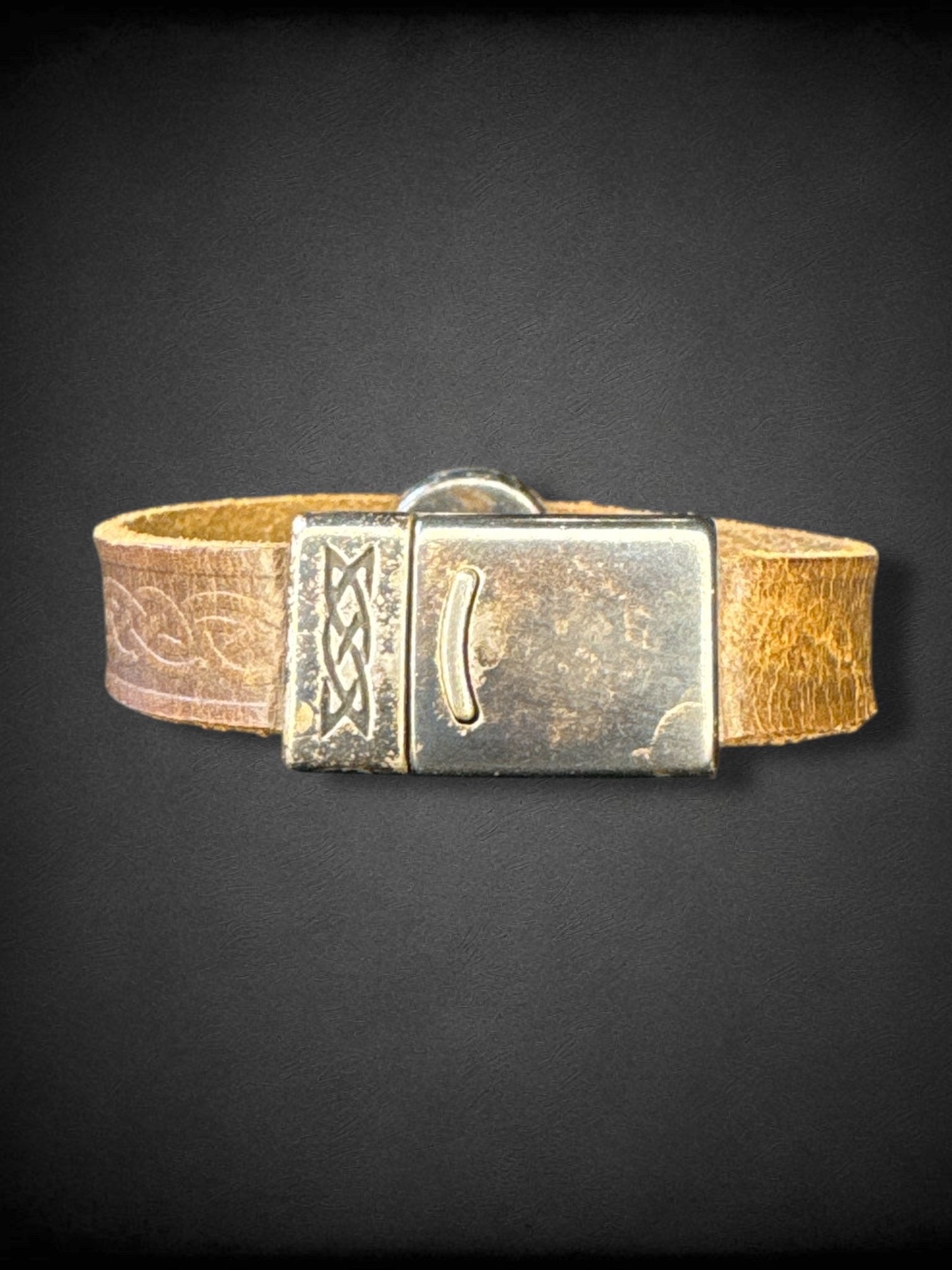 Leather bracelet with Celtic knot embossing and swirl metal pendant handmade in Ireland by Lee River