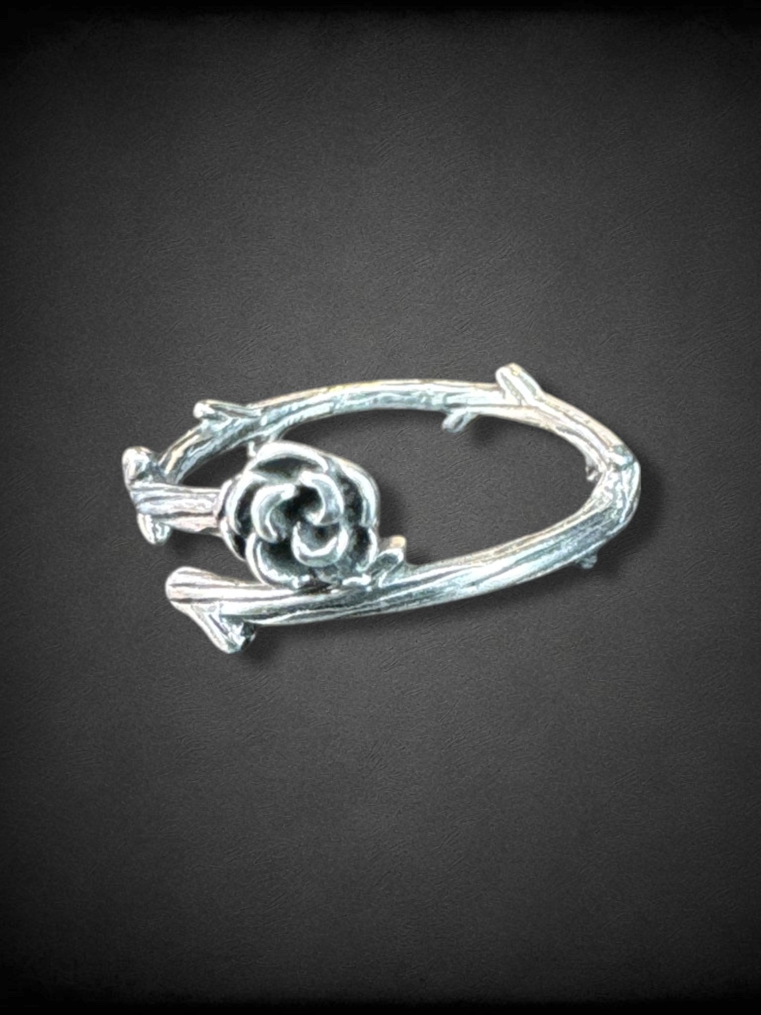 Adjustable silver tone thorn and rose ring