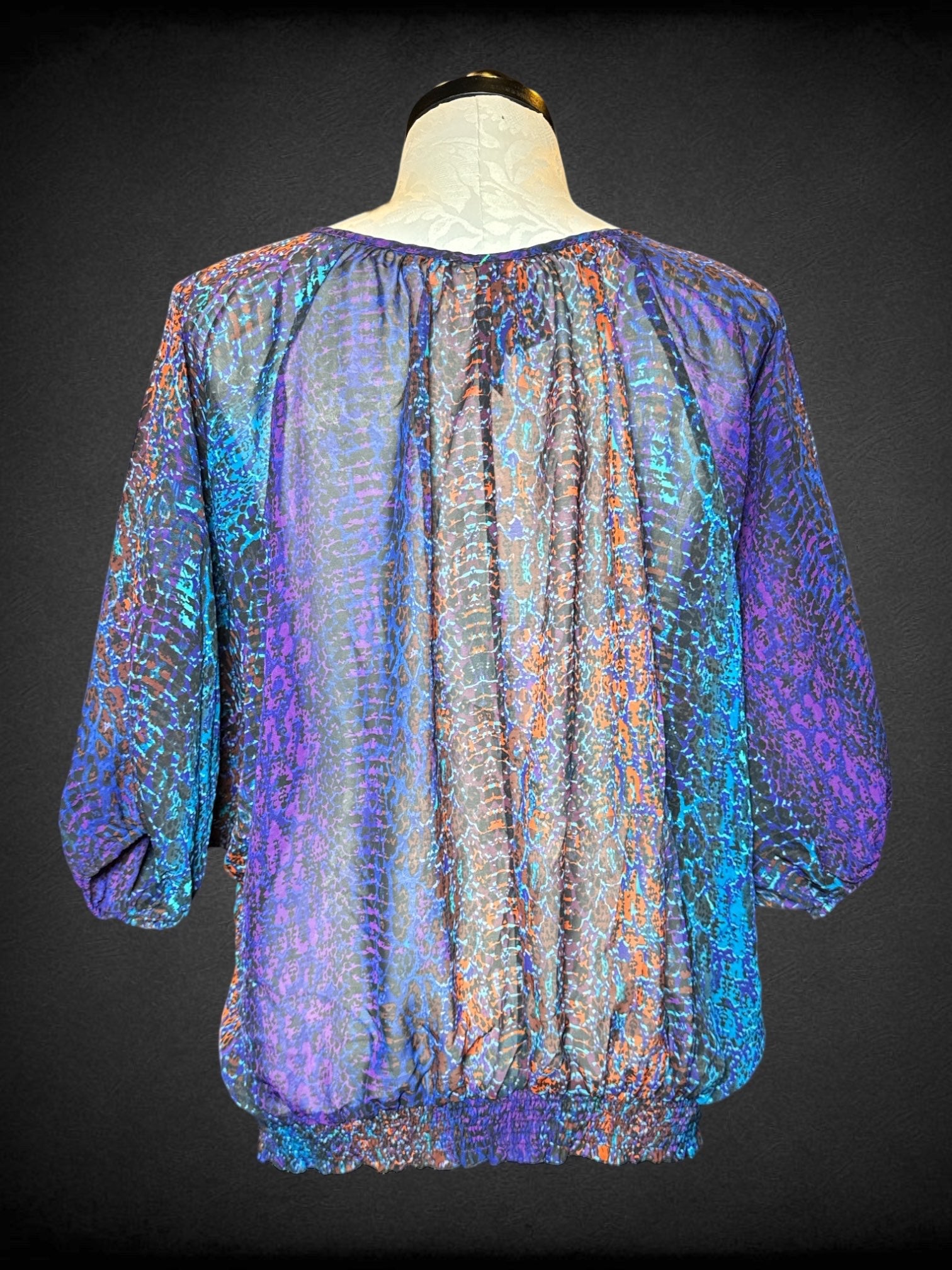 4X Pure Energy multicolor sheer top with balloon sleeves, elastic waist, and anima print design