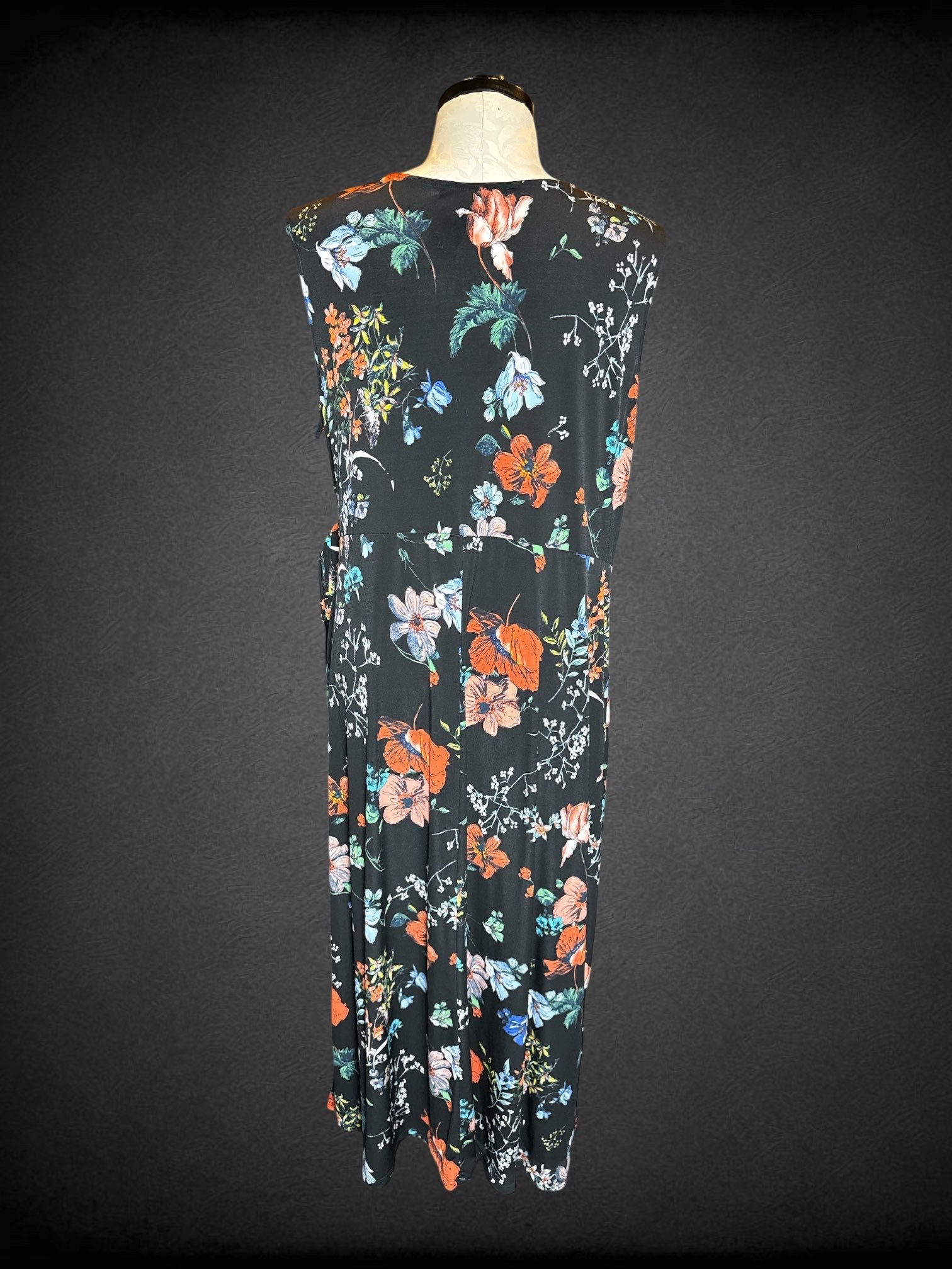 4X Meri Skye black sleeveless floral dress with tie on side, and faux wrap design