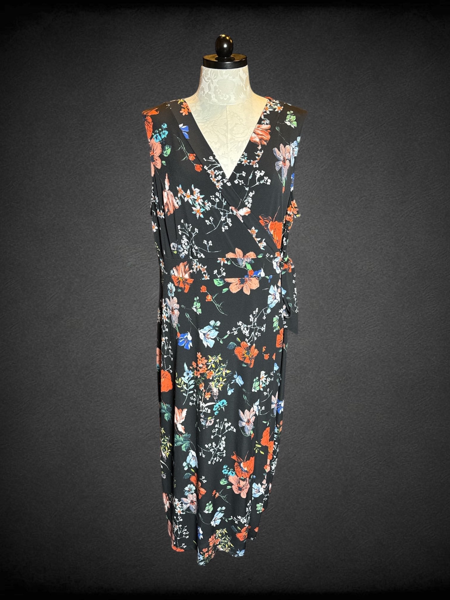 4X Meri Skye black sleeveless floral dress with tie on side, and faux wrap design