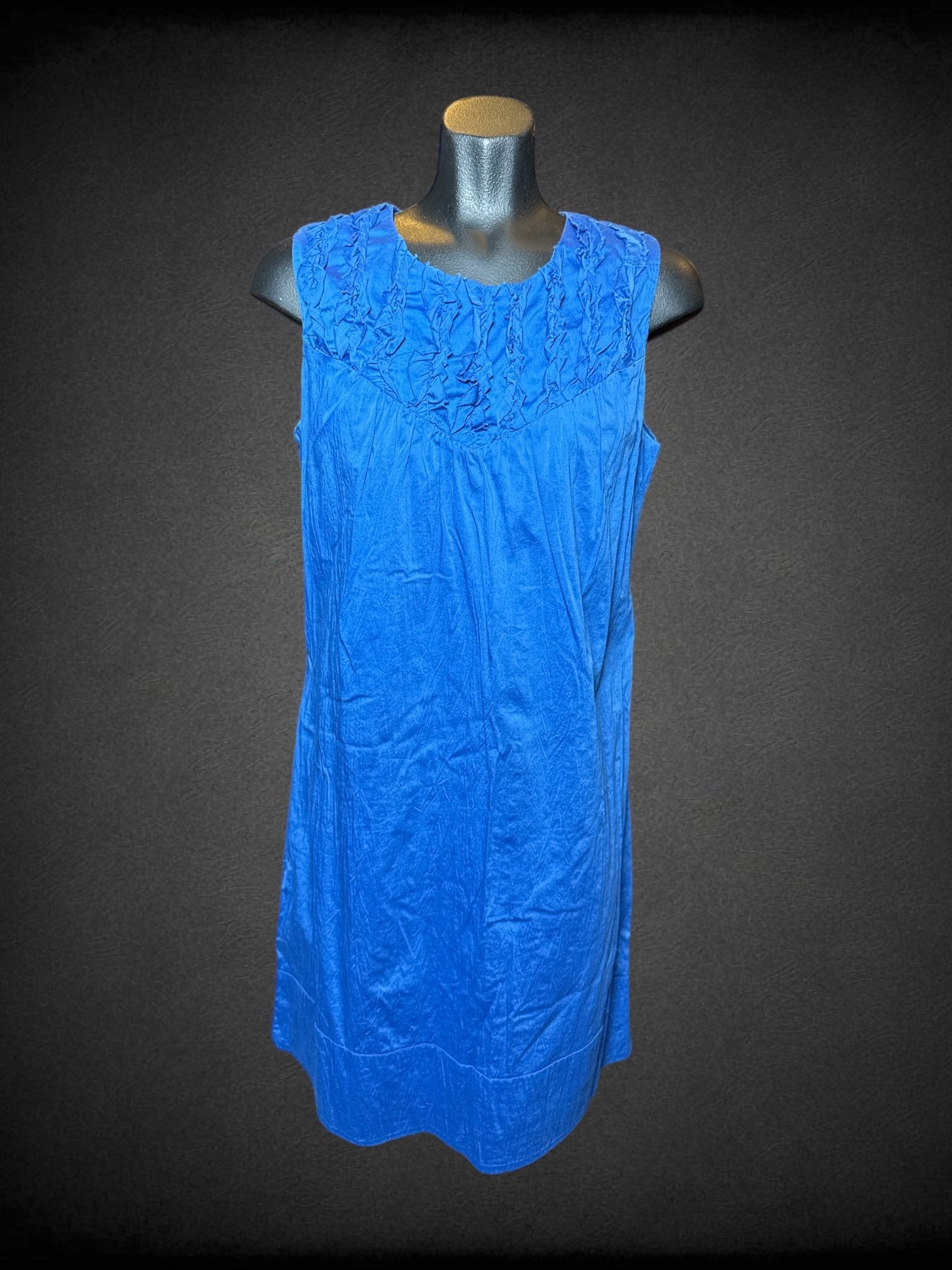 L Calvin Klein blue sleeveless dress with ruffle design on chest, and zipper on back