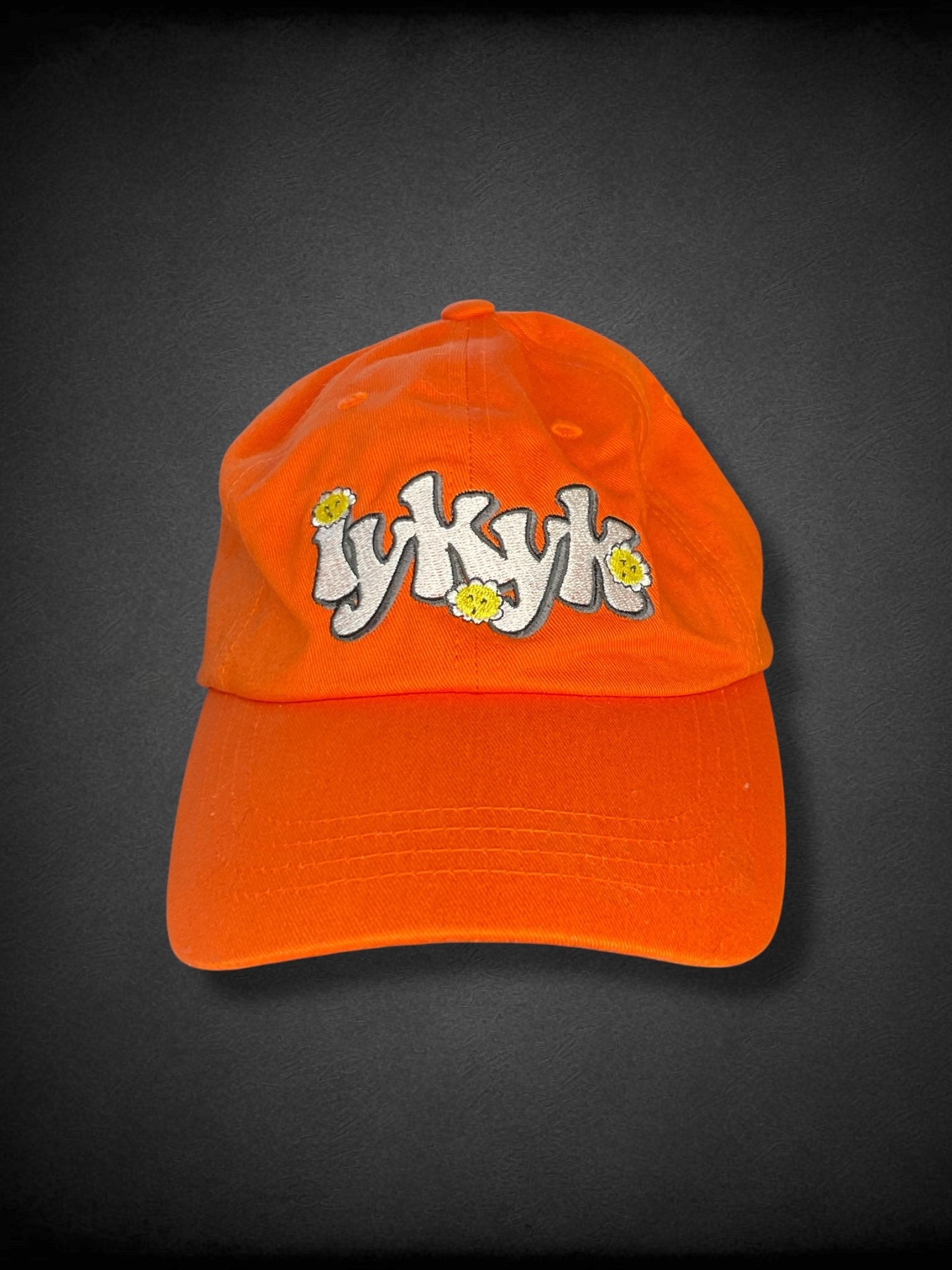 Orange “iykyk” groovy text embroidered baseball cap with flowers