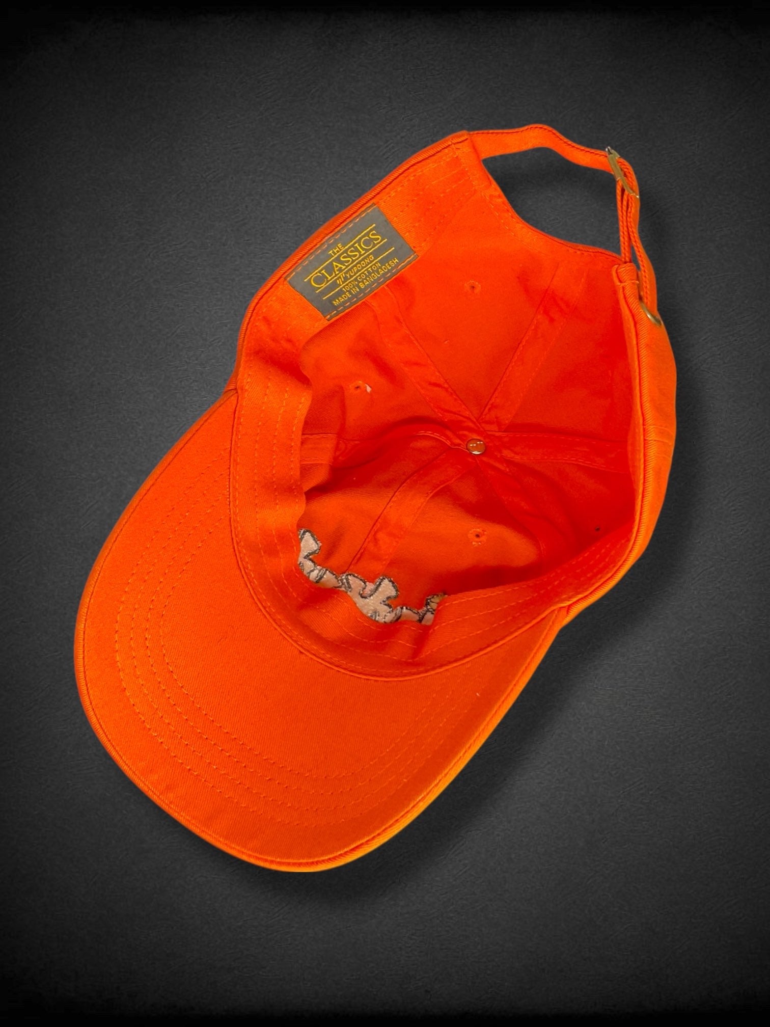 Orange “iykyk” groovy text embroidered baseball cap with flowers