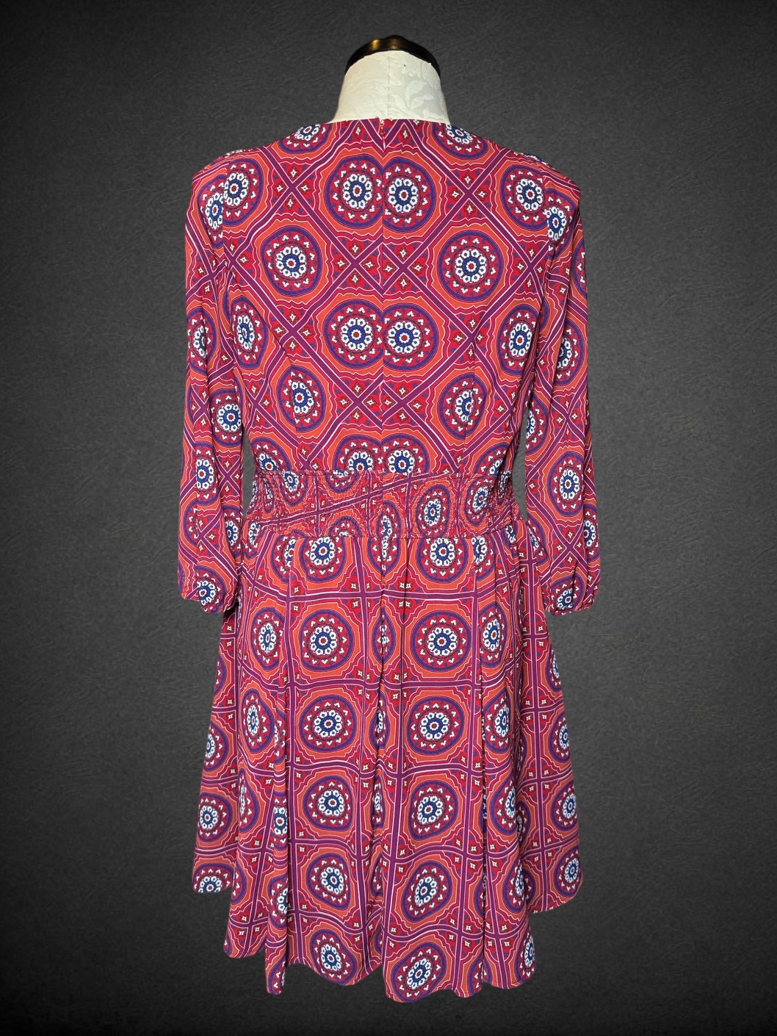 1X Wayward Fancies maroon long sleeve dress with geometric design, shirted waist, pockets, and zipper on back