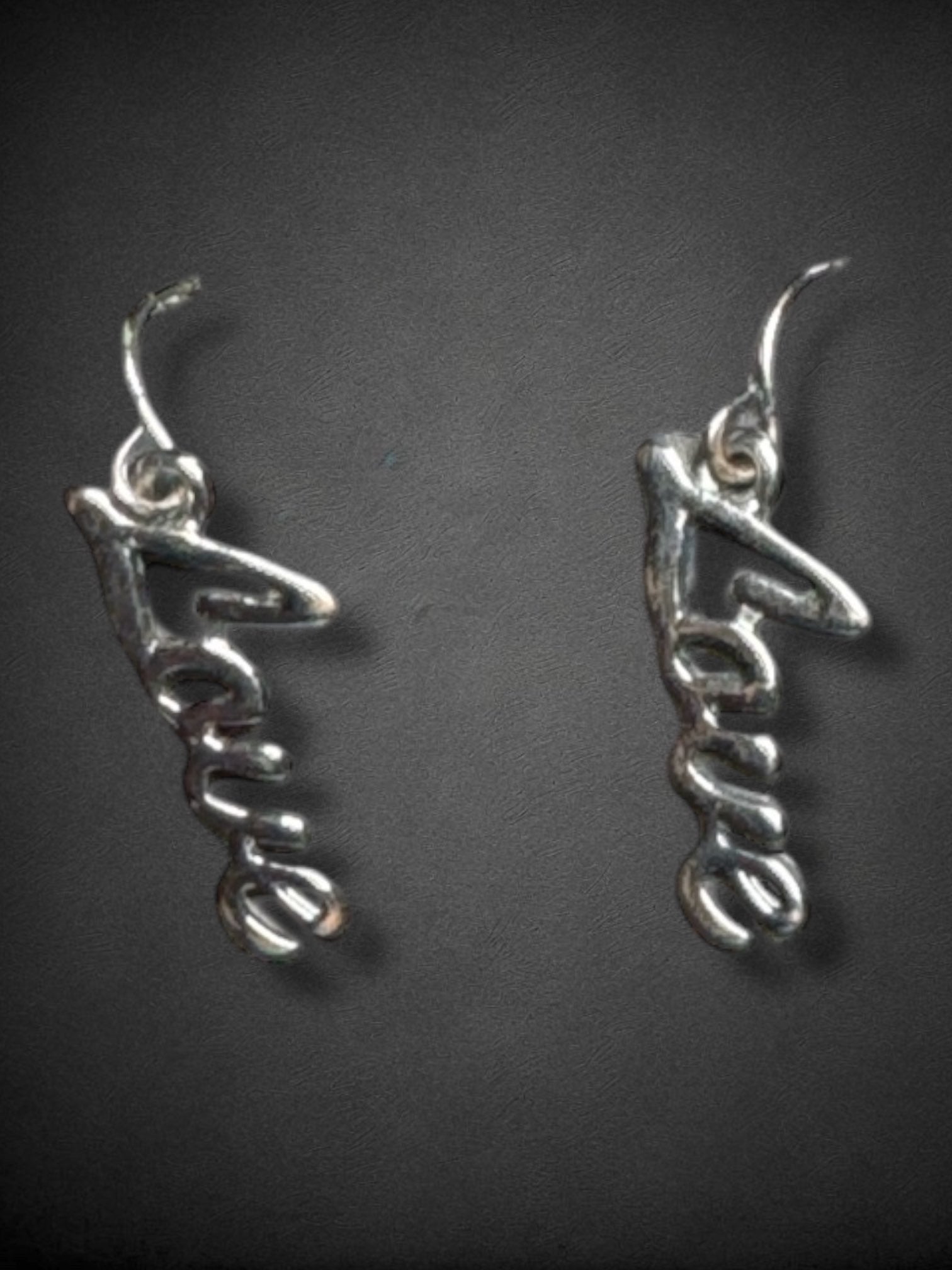 Silver tone cursive love earrings