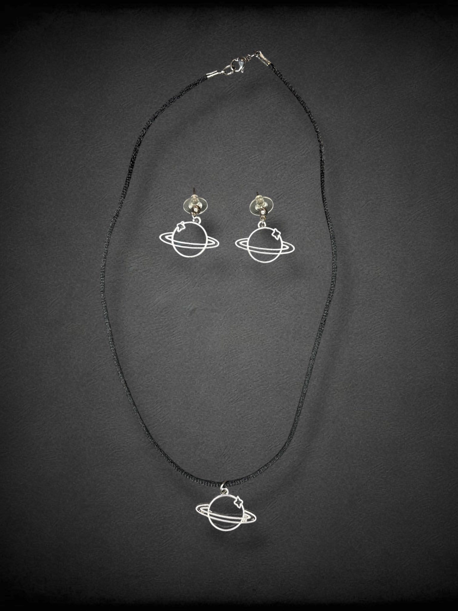 Saturn silver tone earring and 9 inch black cord necklace set