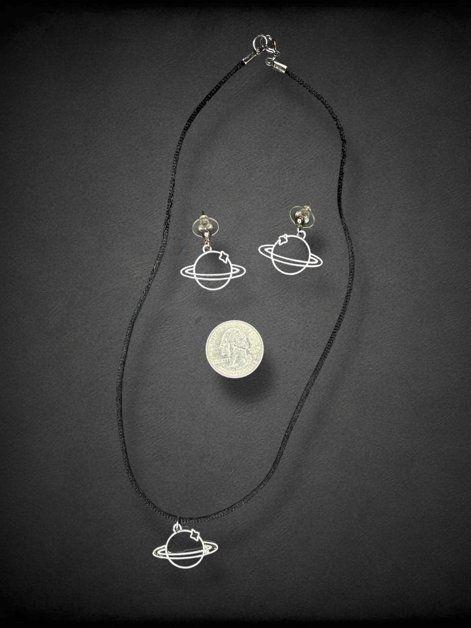 Saturn silver tone earring and 9 inch black cord necklace set