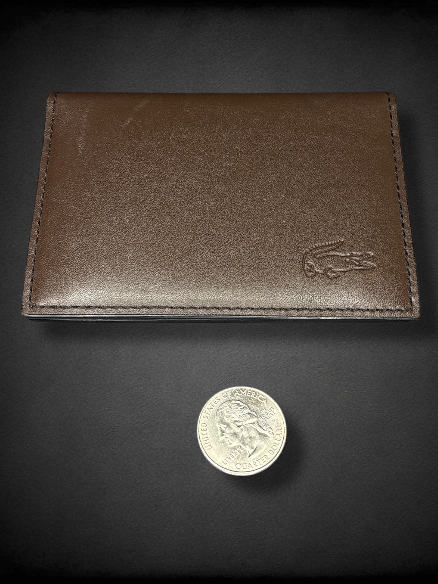 LACOSTE brown leather bi-fold card wallet with minor marks