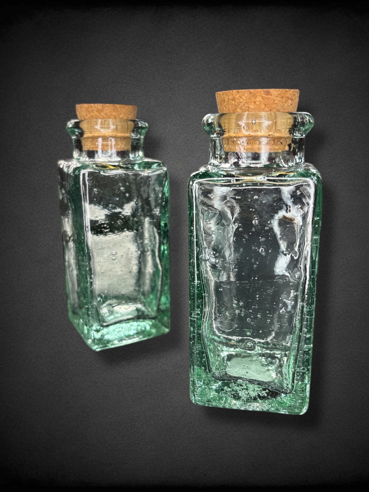 Set of 2 thick green glass jars with cork lids