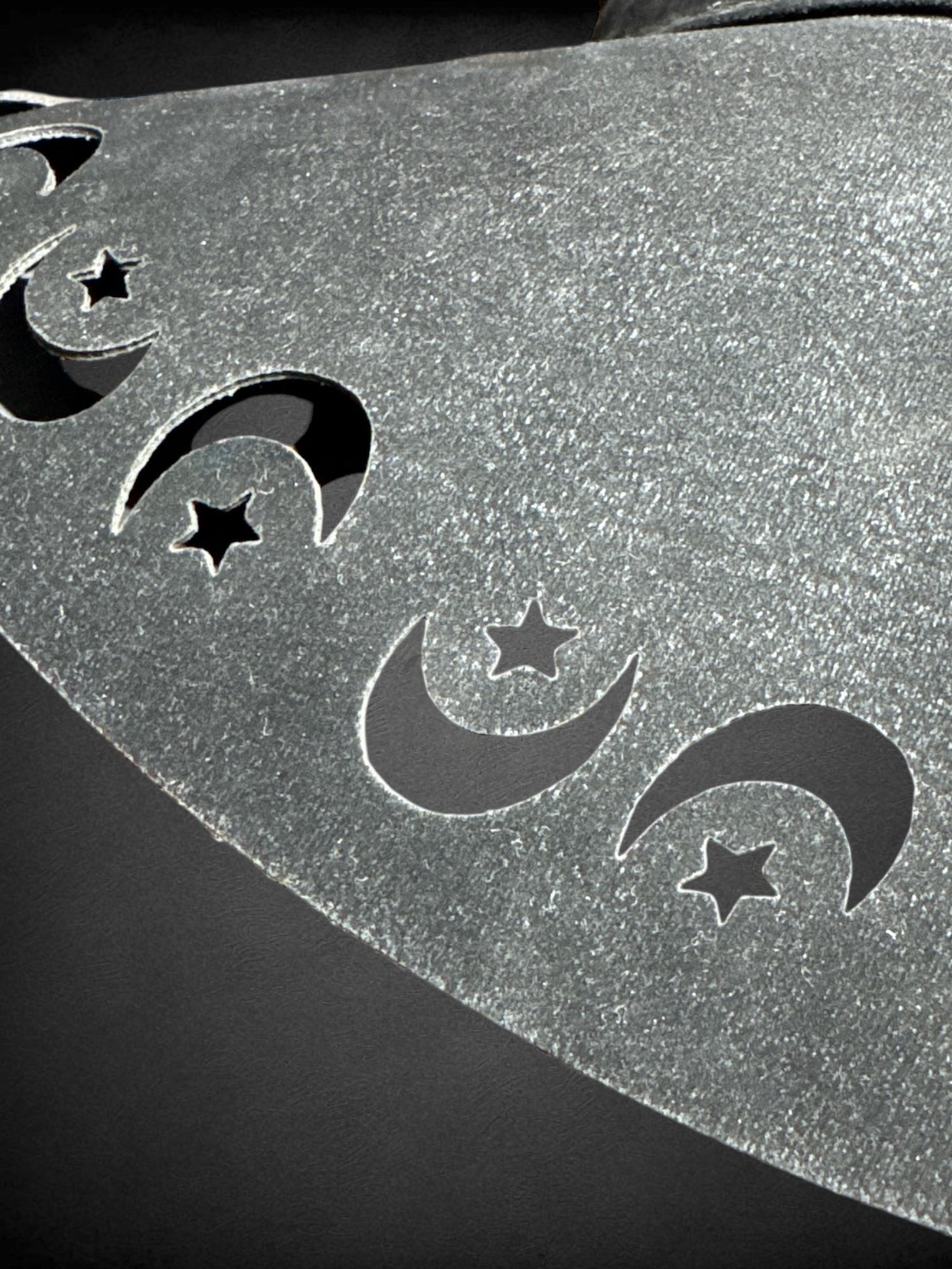 Black pleather suede like sun hat with moon and star cutouts