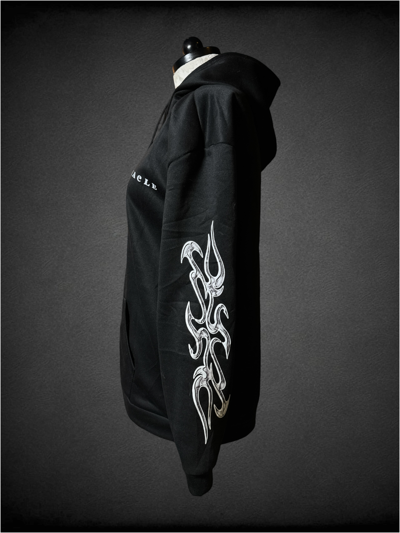 2X black hoodie with “miracle” design and graphic sleeves