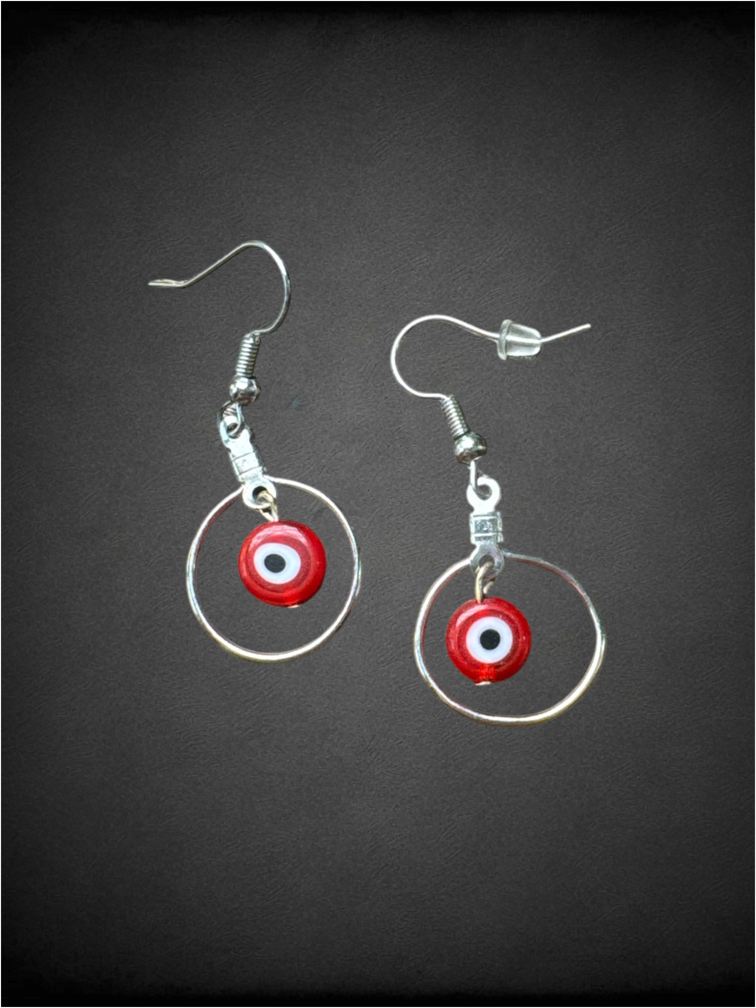 Red evil eye dangly earrings