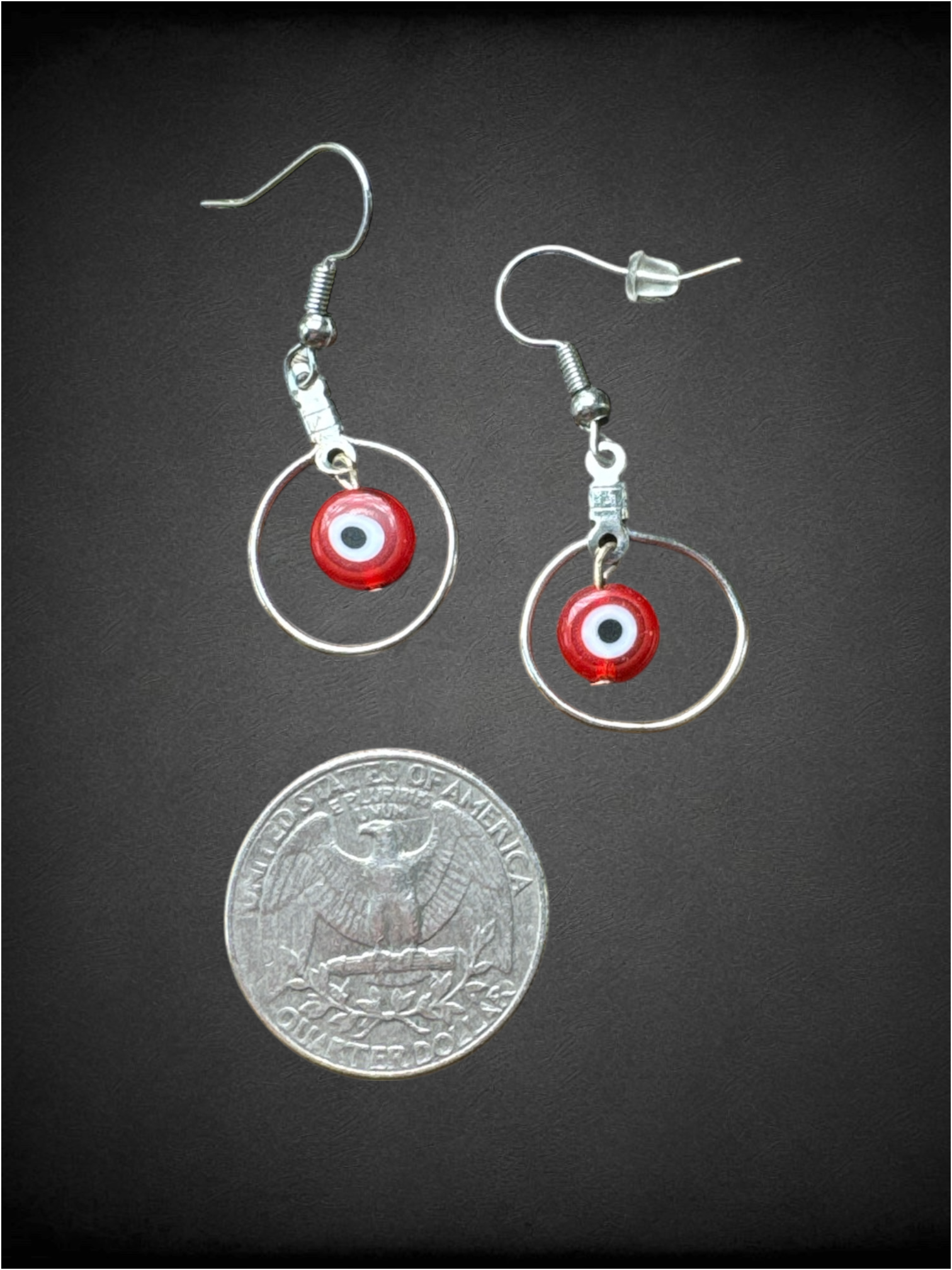 Red evil eye dangly earrings