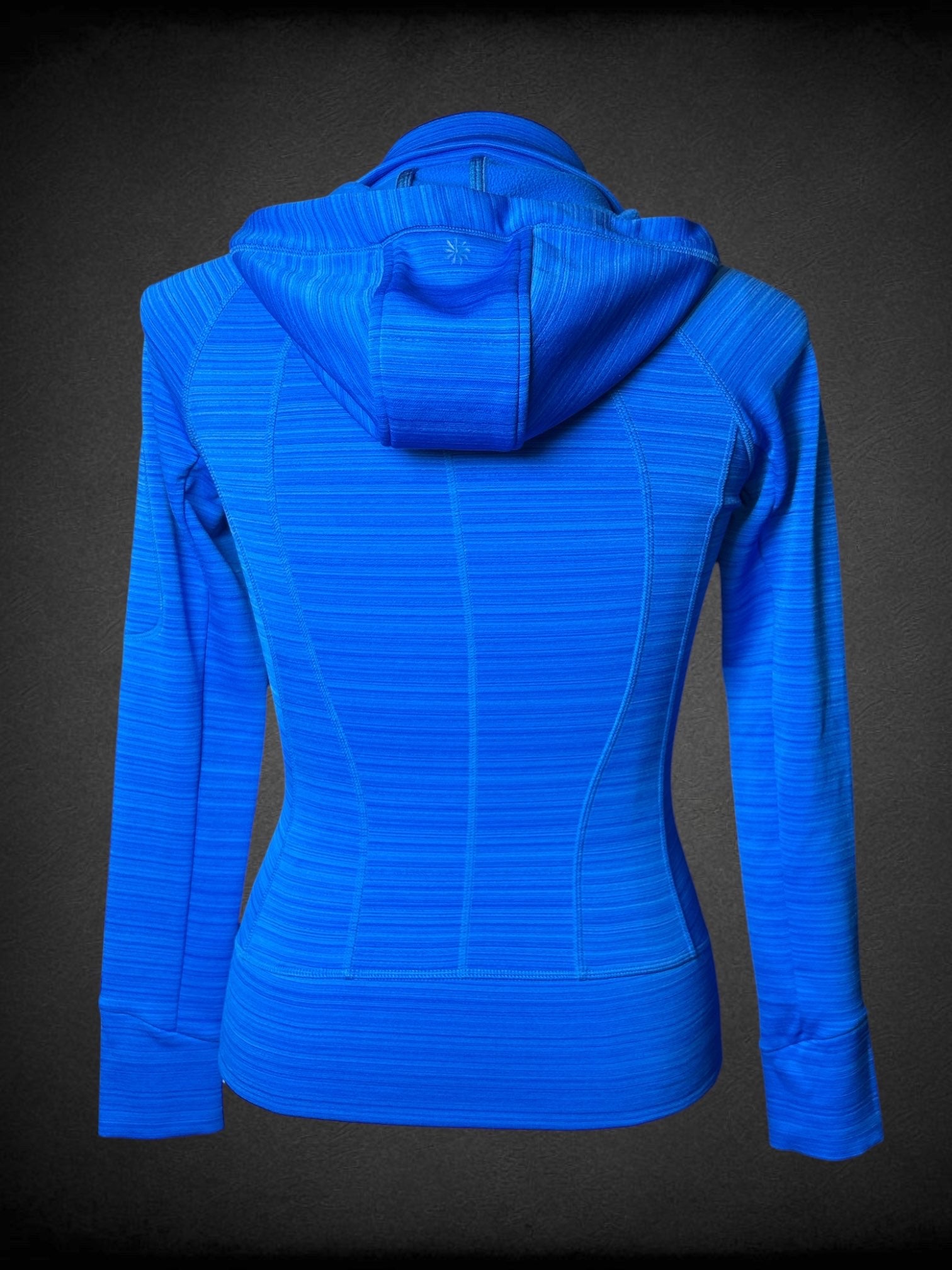 L ATHLETA blue zip-up althetic fleece lined hooded jacket with horizontal stripes, thump holes, and sleeve zip pocket