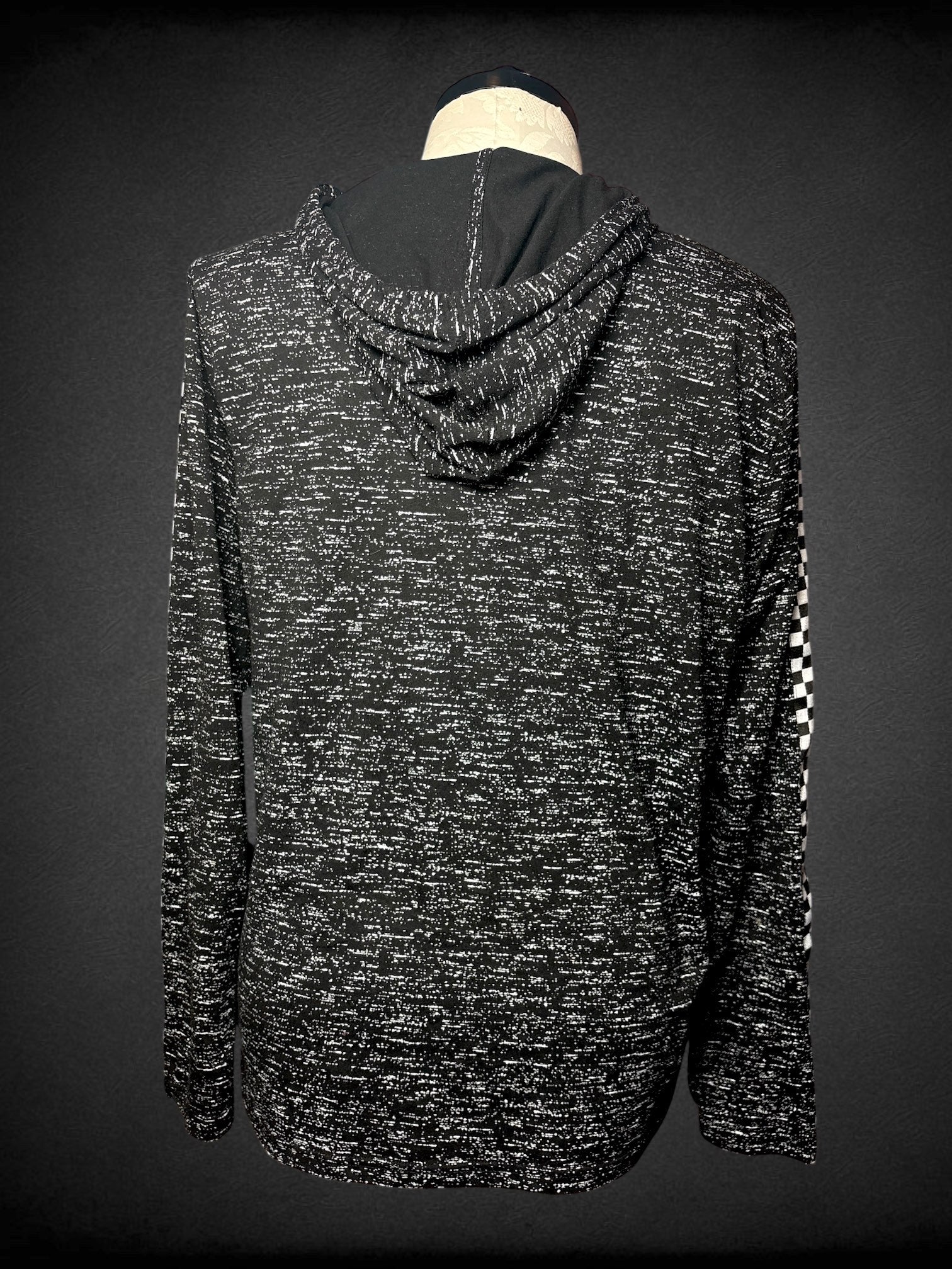 1X Brooklyn Cloth black hooded sweatshirt with white speckling, checker print appliqué on sleeves, and red “Good Vibes” appliqué on front