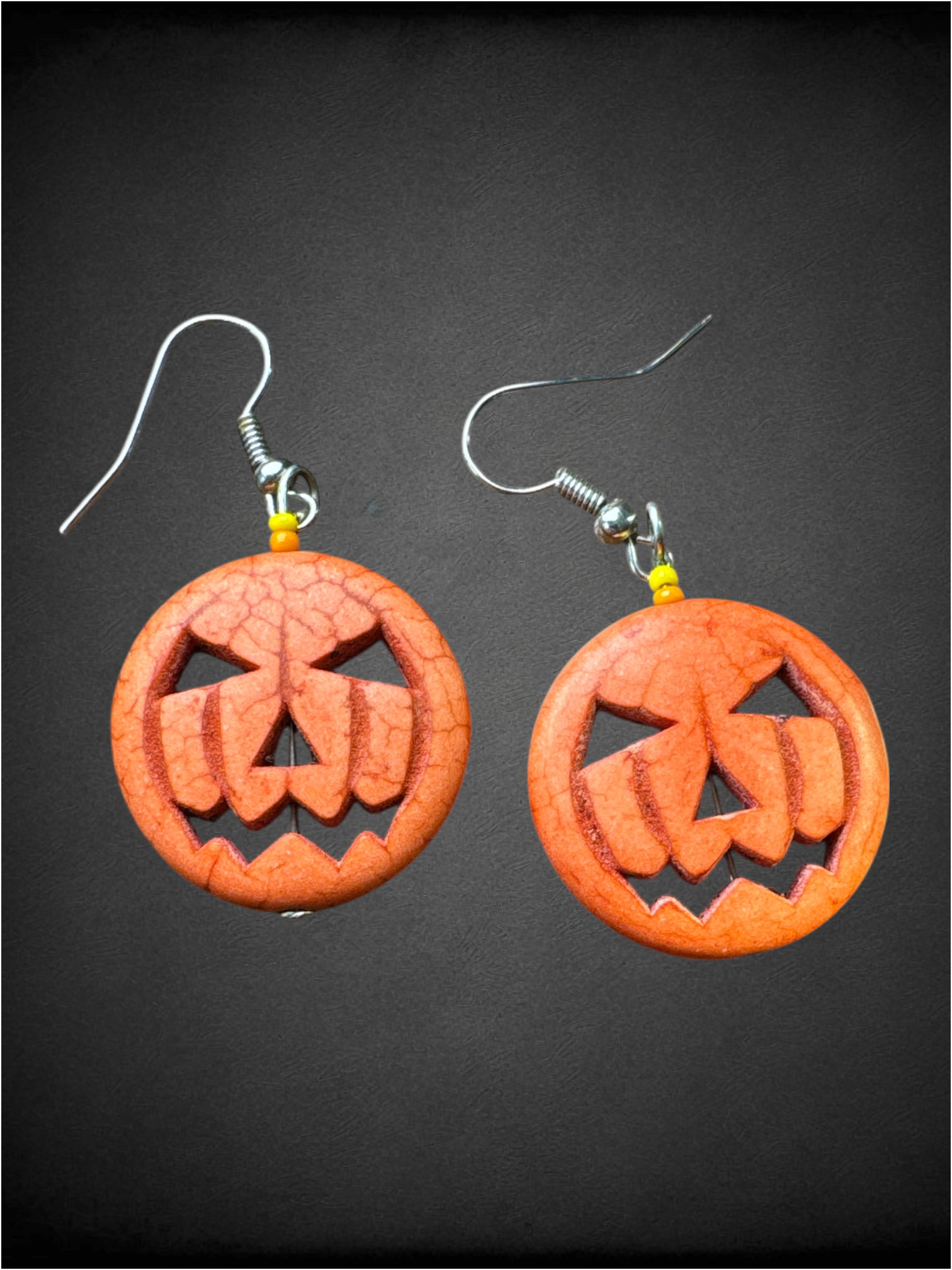 Orange carved stone jack o lantern earrings