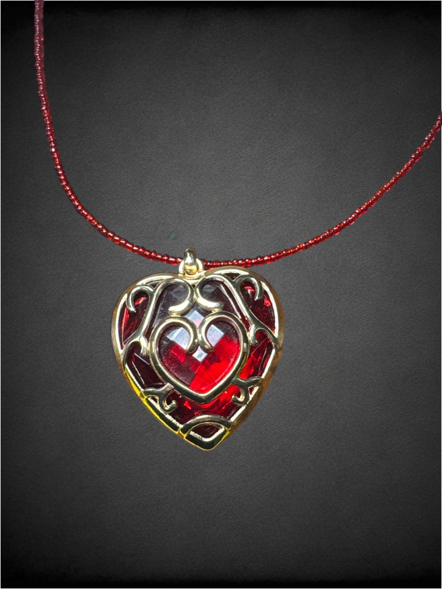 Red beaded chain with "Heart Container" pendant from The Legend of Zelda