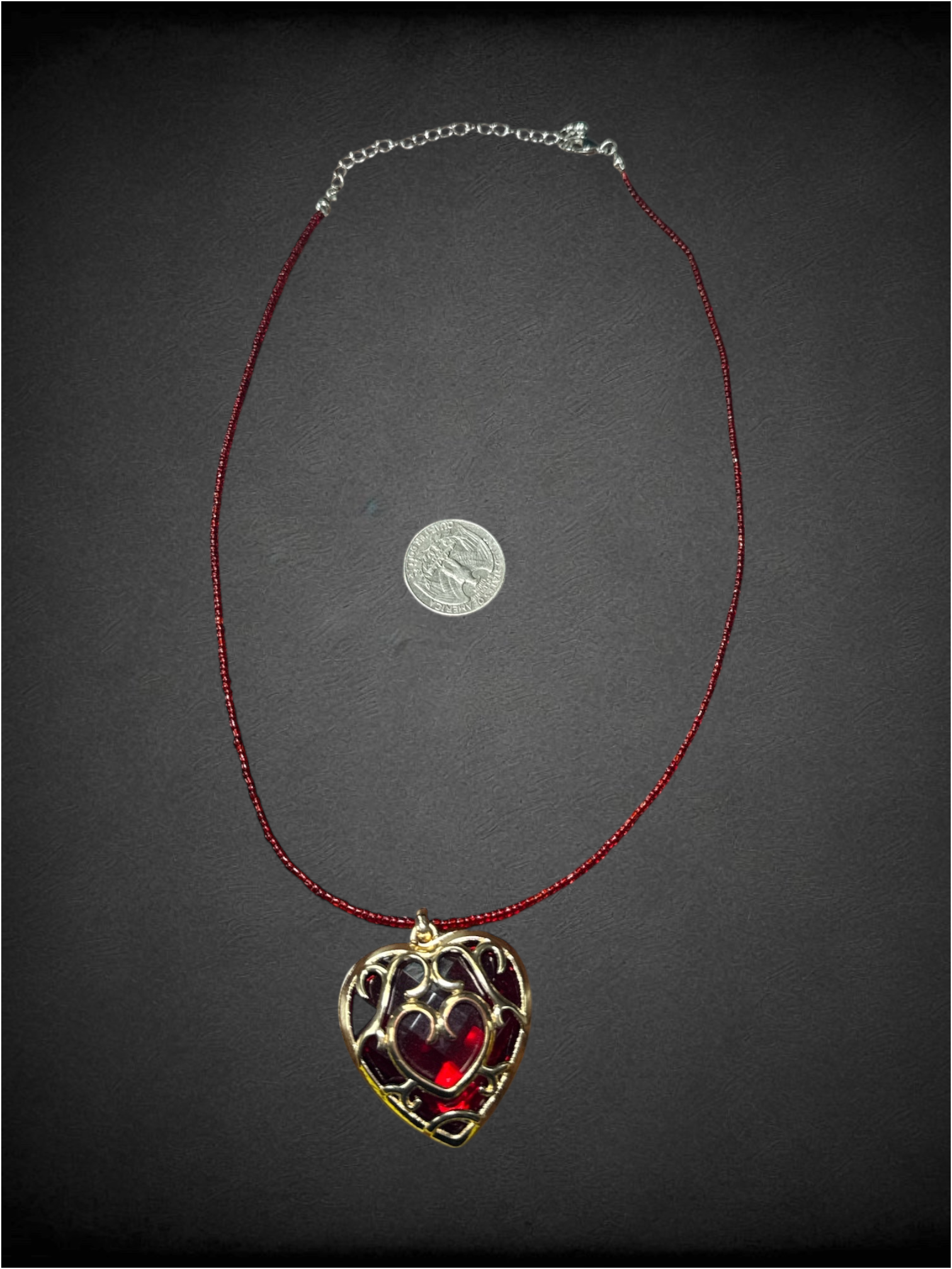 Red beaded chain with "Heart Container" pendant from The Legend of Zelda