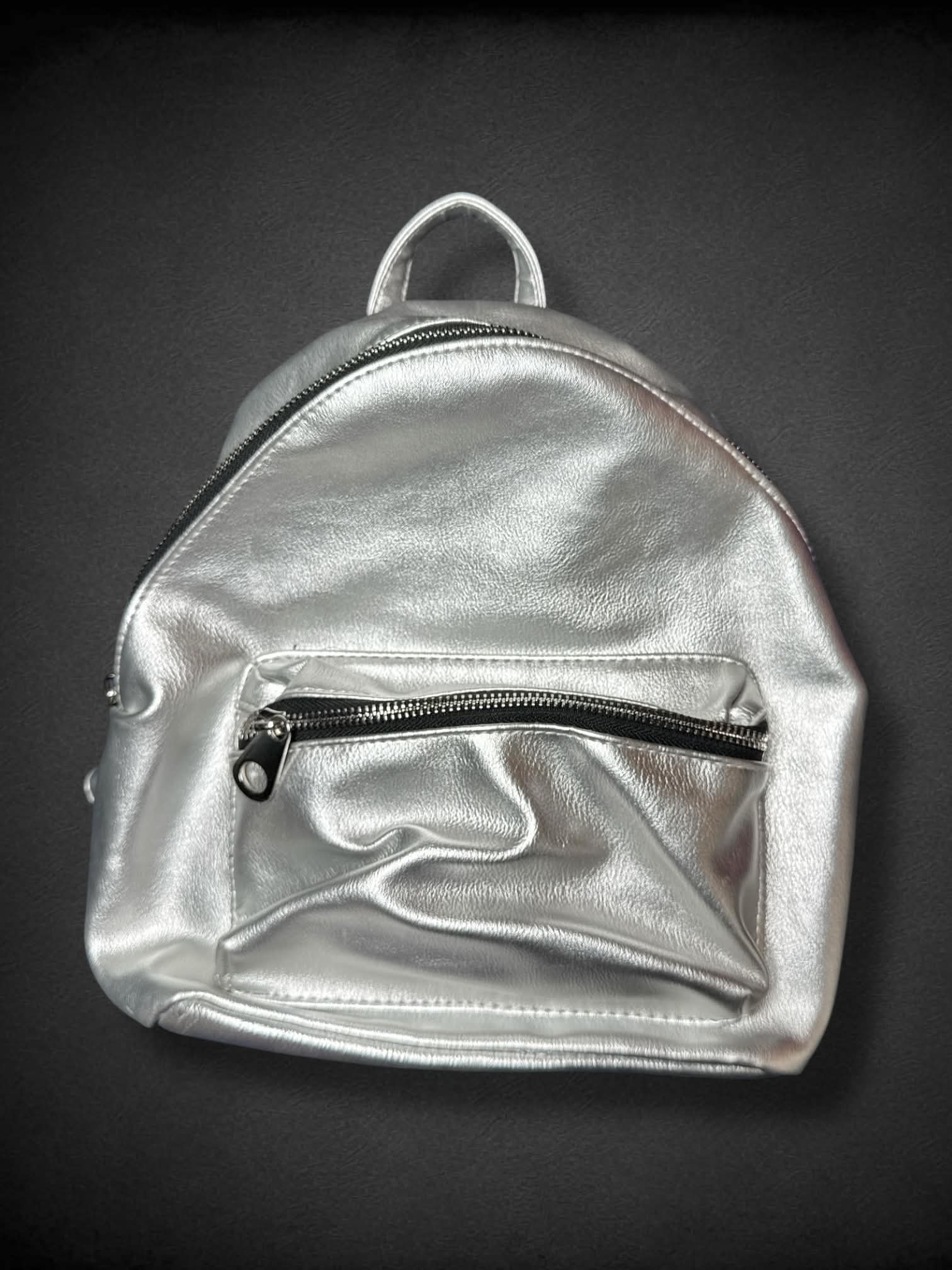 American Eagle Silver Mini Backpack with black and white polka dot interior