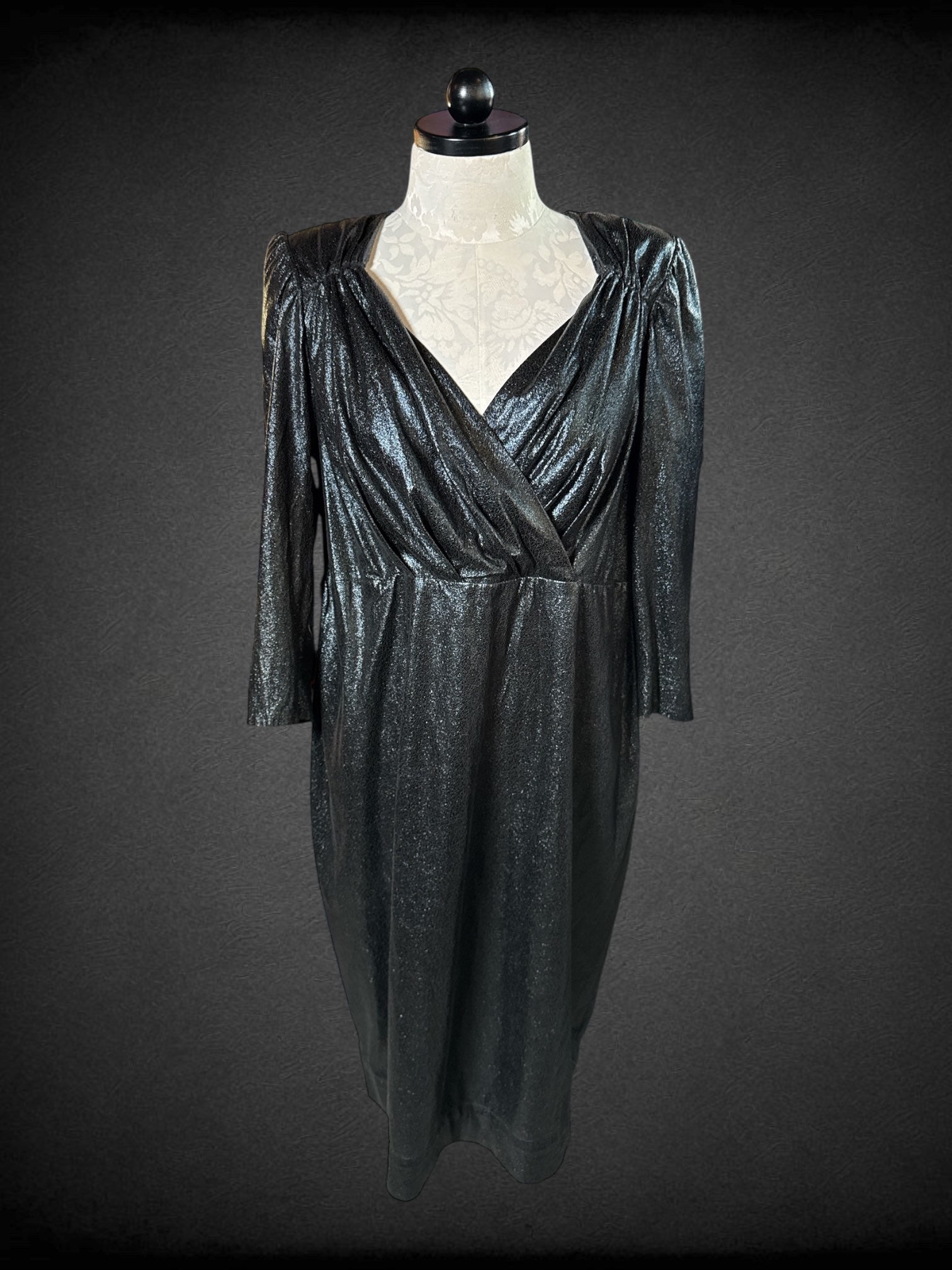 1X Eloquii black long sleeve dress with zipper on back, shoulder pads, and faux leather texture