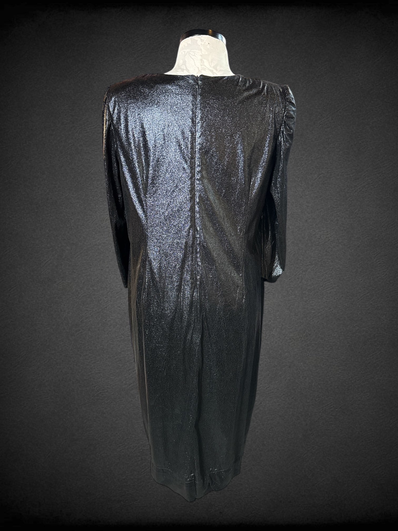 1X Eloquii black long sleeve dress with zipper on back, shoulder pads, and faux leather texture