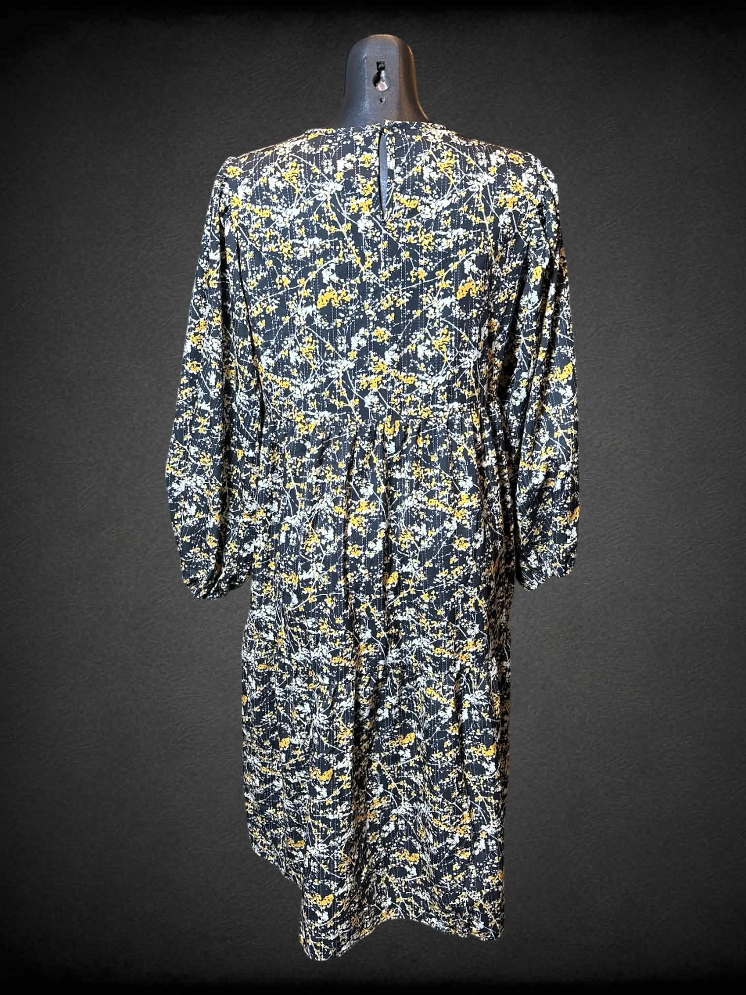 M Black, white, and yellow long sleeve dress with botanical and tiered design
