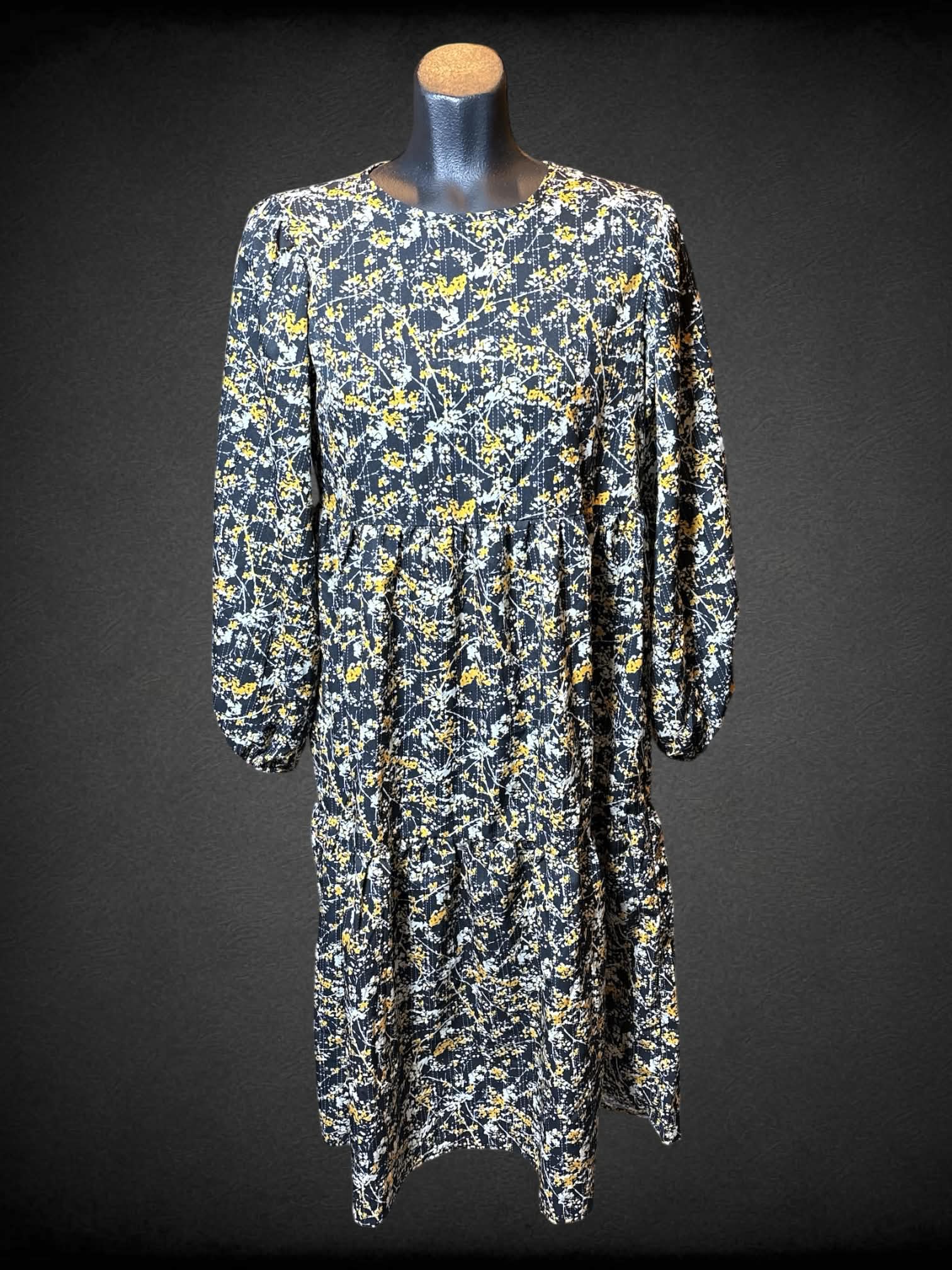 M Black, white, and yellow long sleeve dress with botanical and tiered design
