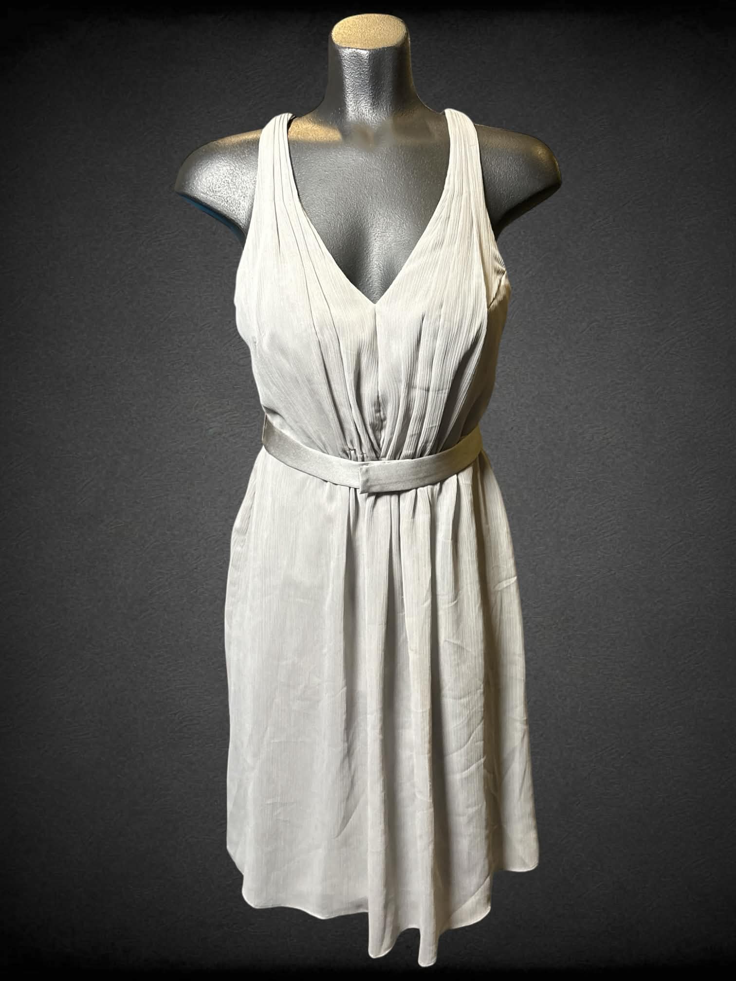 S White by Vera Wang grey sleeveless dress with crossed straps, matching snap button belt, and zipper on back