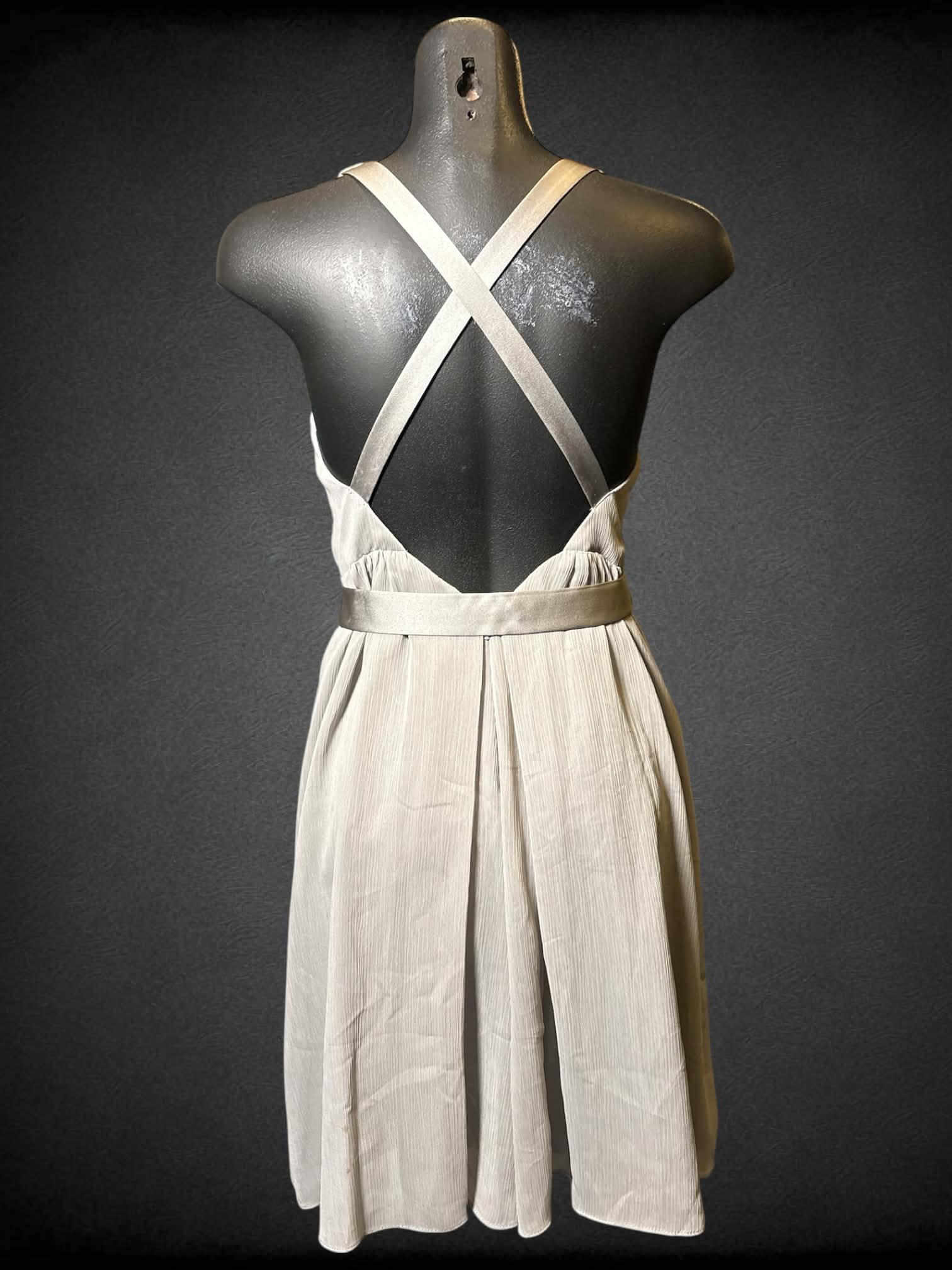 S White by Vera Wang grey sleeveless dress with crossed straps, matching snap button belt, and zipper on back