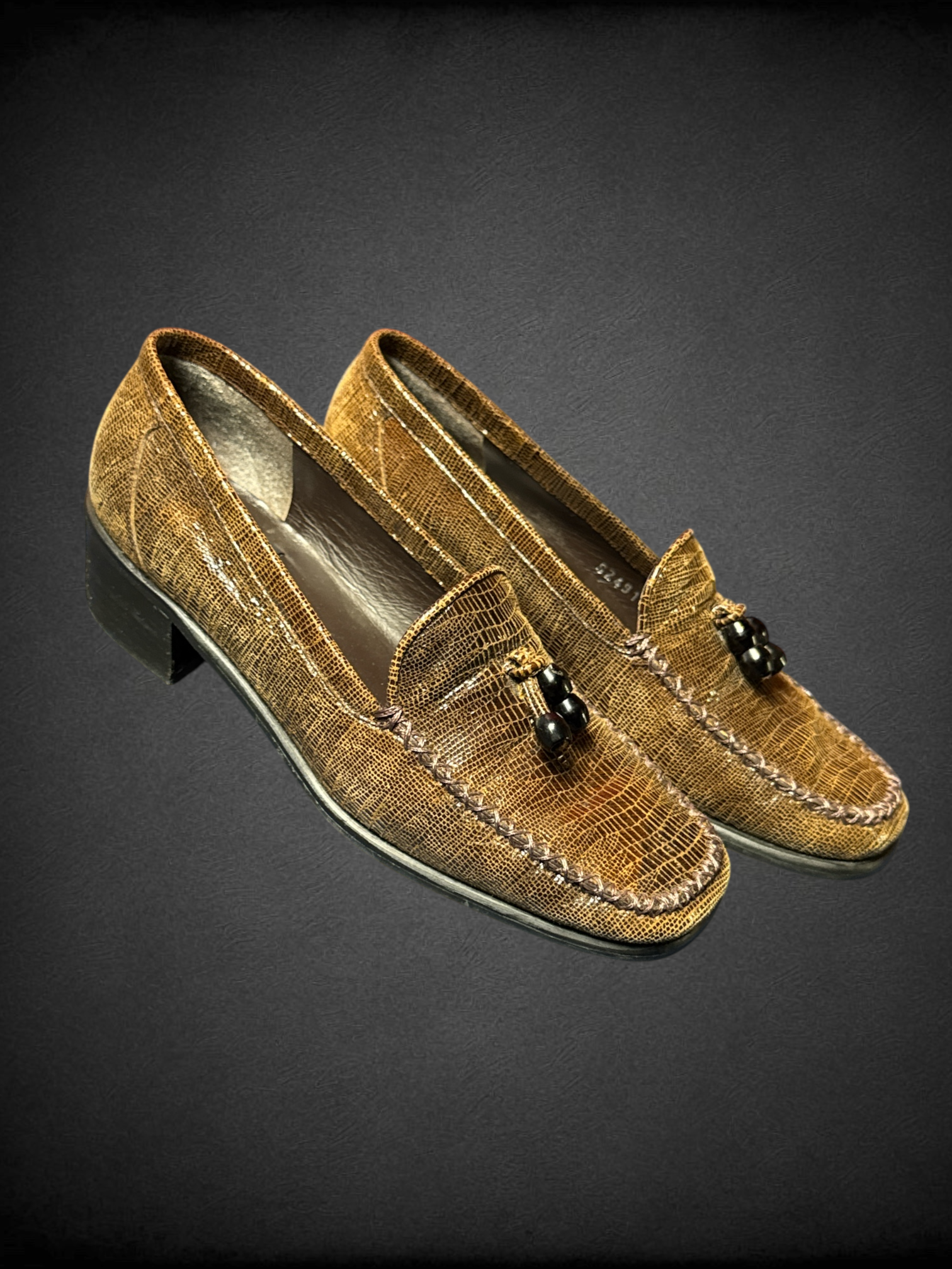 Size 6 Stuart Weitzman brown loafers with croc-embossed leather pattern and beaded tassel embellishments