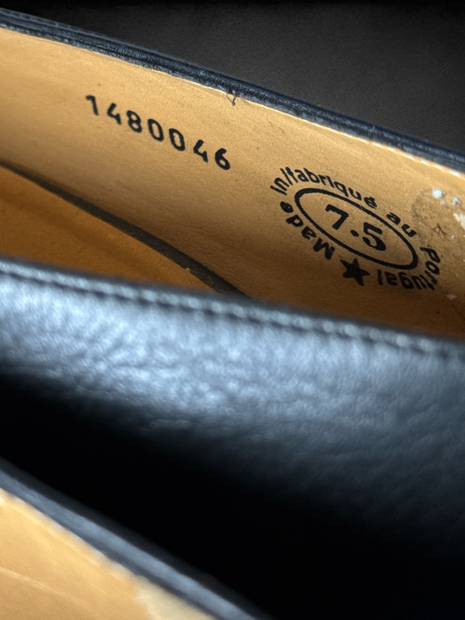 Size 7.5 John Fluevog Makena slip-on shoes featuring a pointed toe, a large metal ring, and stud detailing and dust bag included