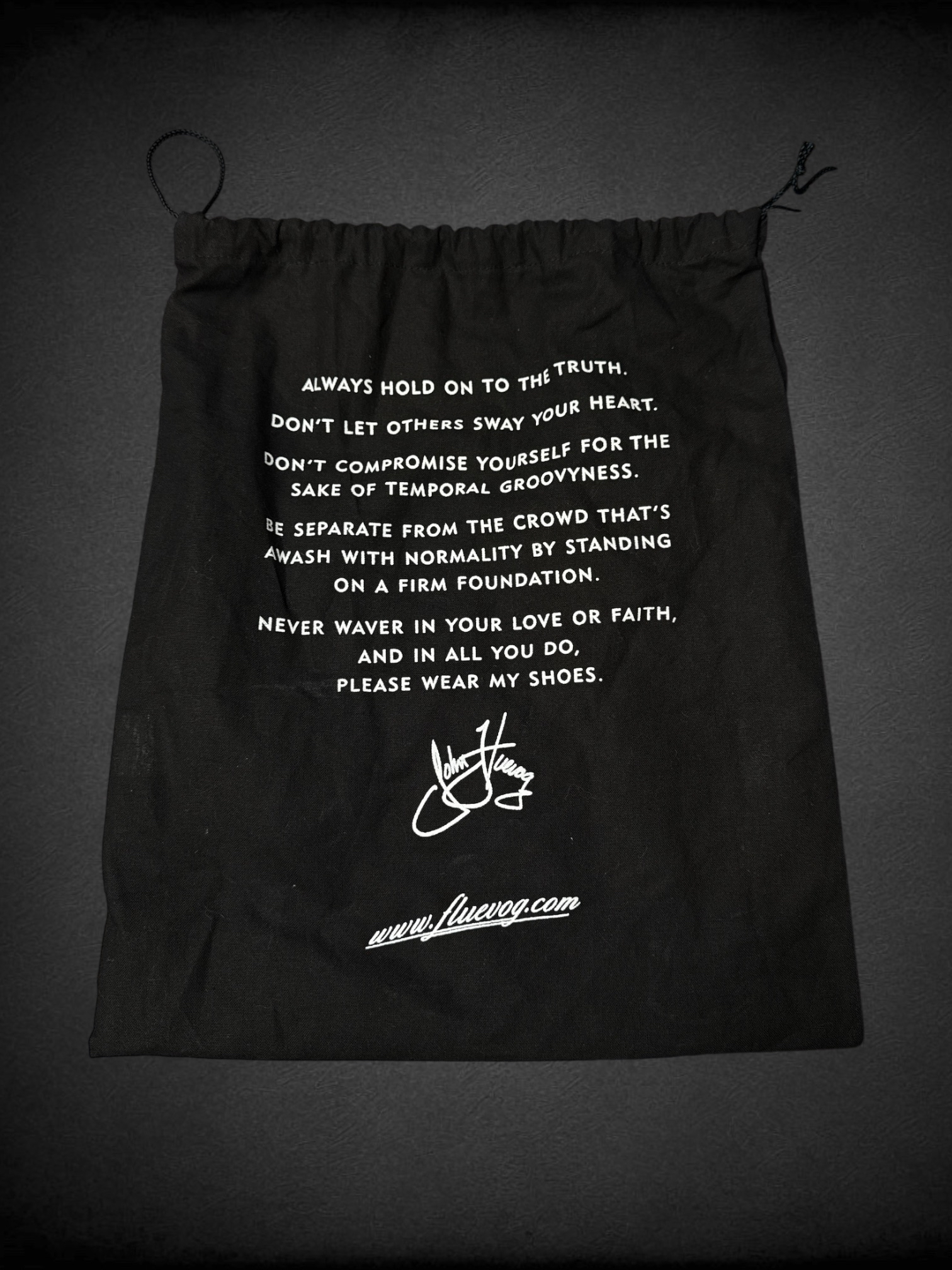 Size 7.5 John Fluevog Makena slip-on shoes featuring a pointed toe, a large metal ring, and stud detailing and dust bag included