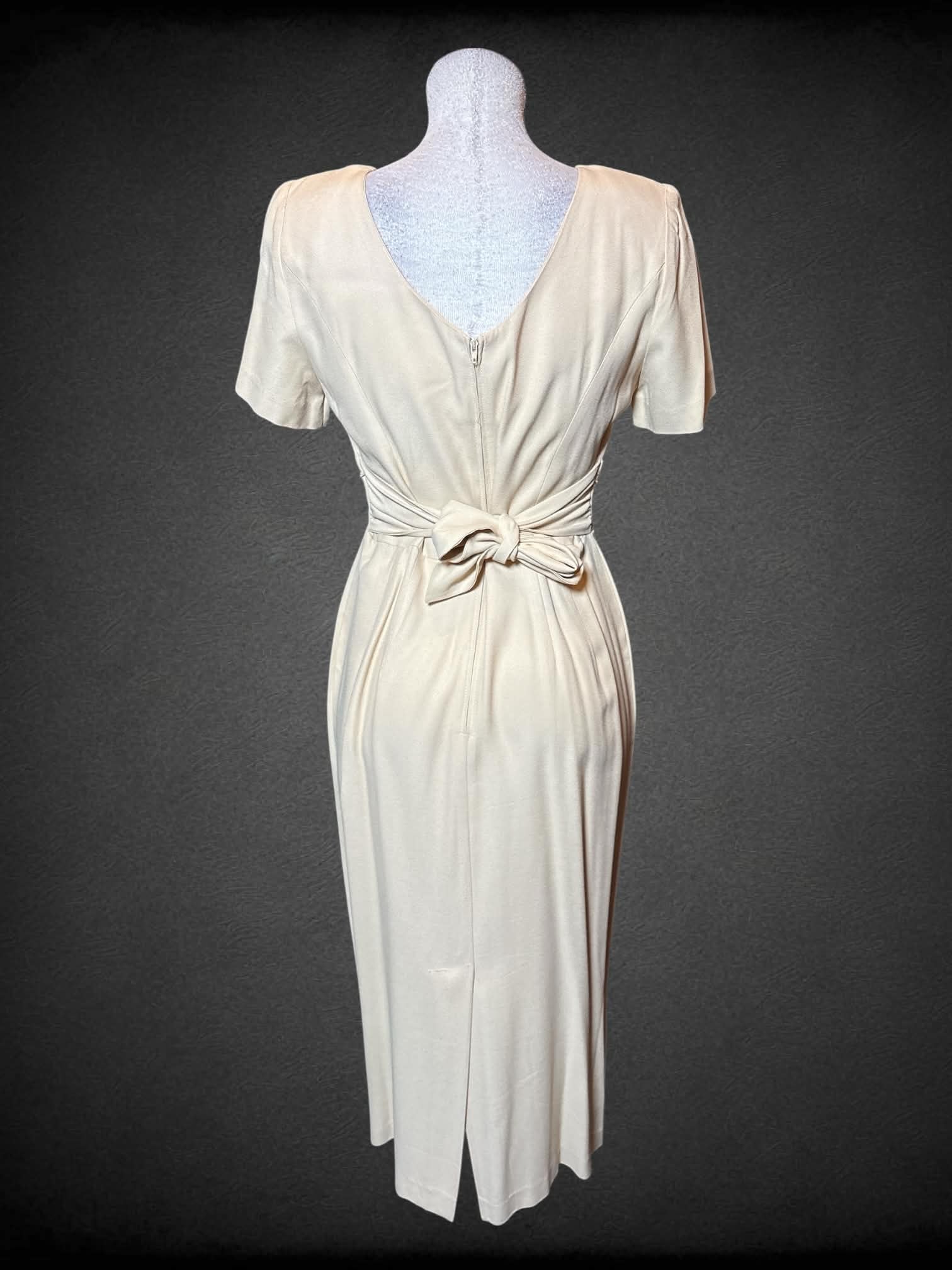 M John Roberts vintage light yellow short sleeve dress with embroidery on waist, tie & zipper on back, and shoulder pads