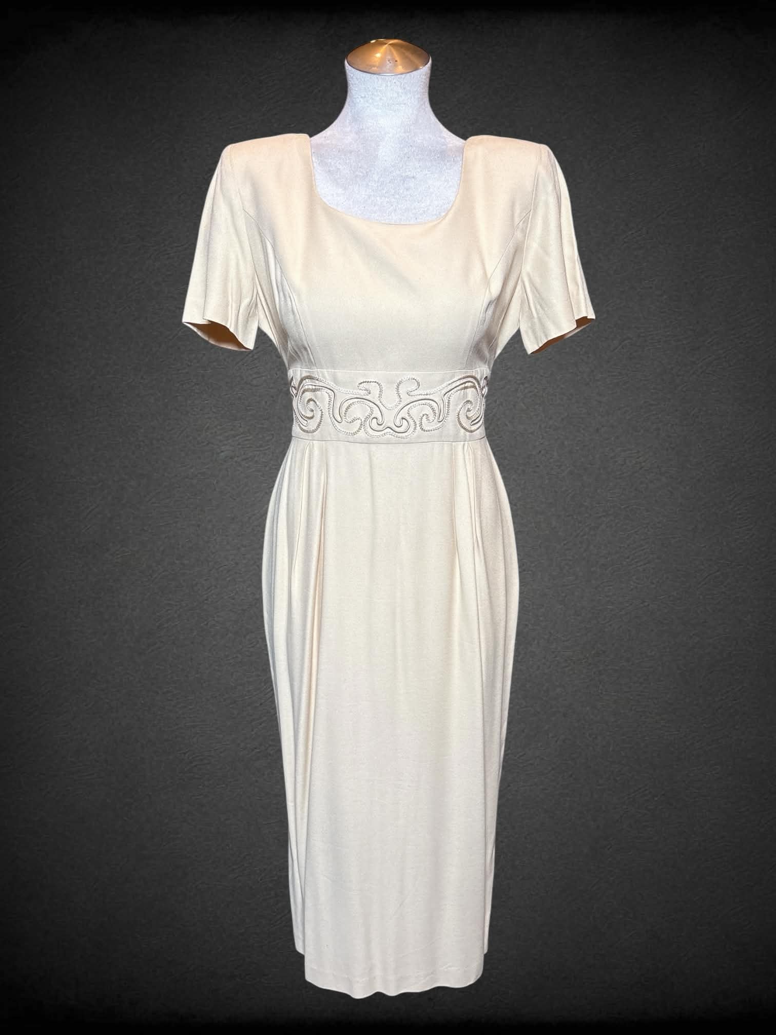 M John Roberts vintage light yellow short sleeve dress with embroidery on waist, tie & zipper on back, and shoulder pads