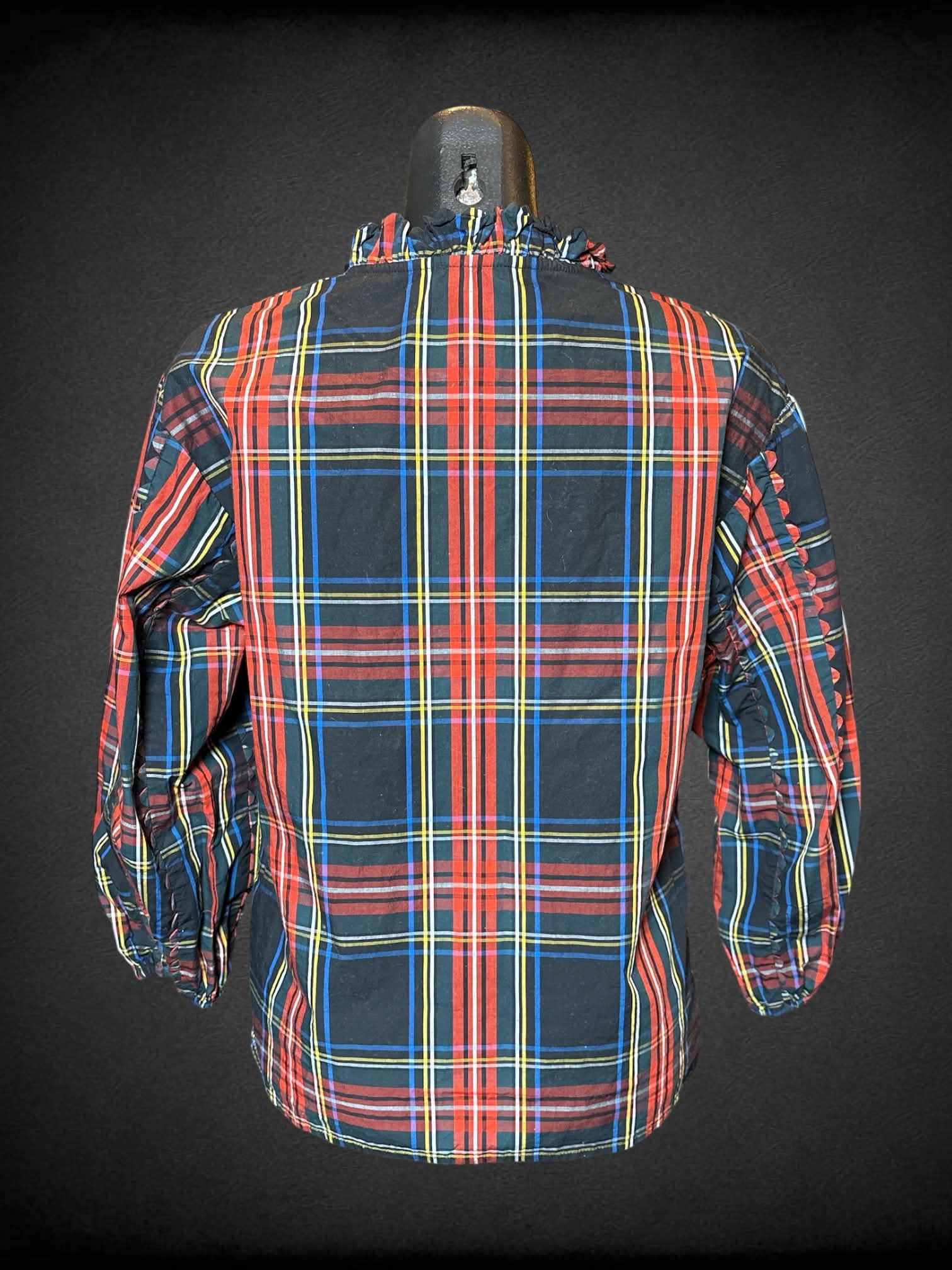 S J Crew black long sleeve plaid top with ruffled neck, tie on neck, and scalloped design on sleeves