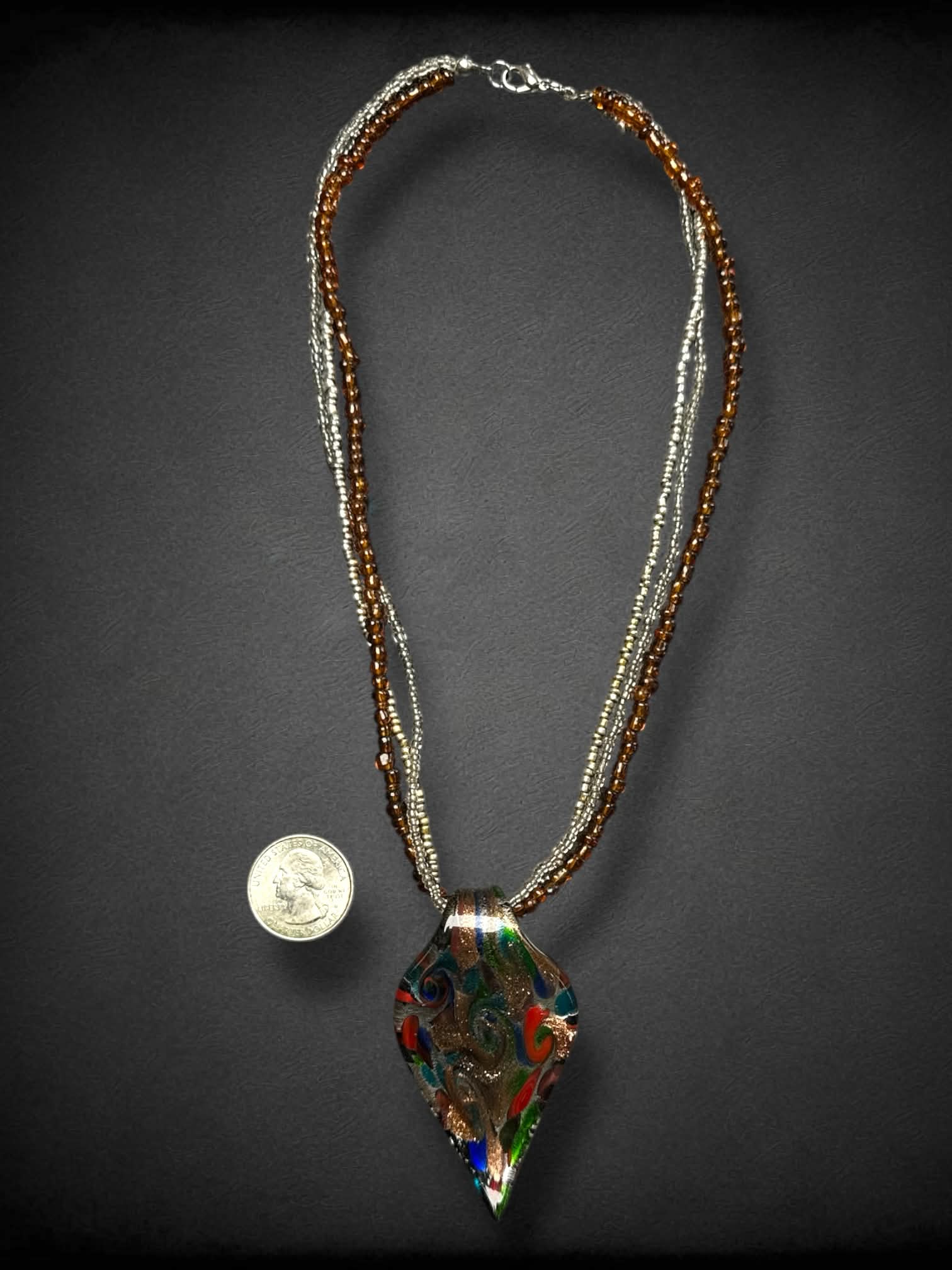 Multicolor spiral glass leaf necklace with multiple beaded strands