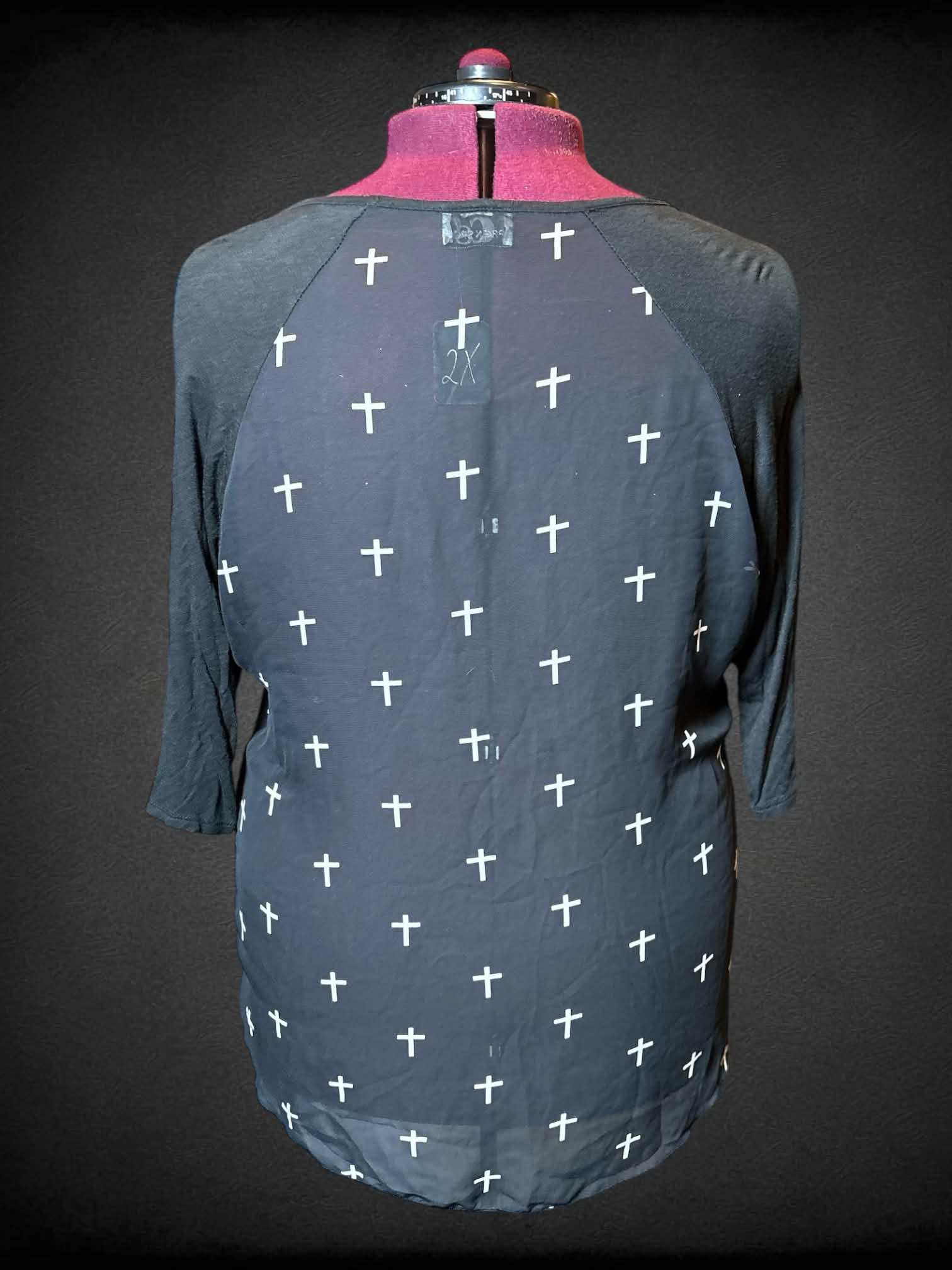 2X Caren Sport black t shirt with white crosses on back, and white New York cross on front
