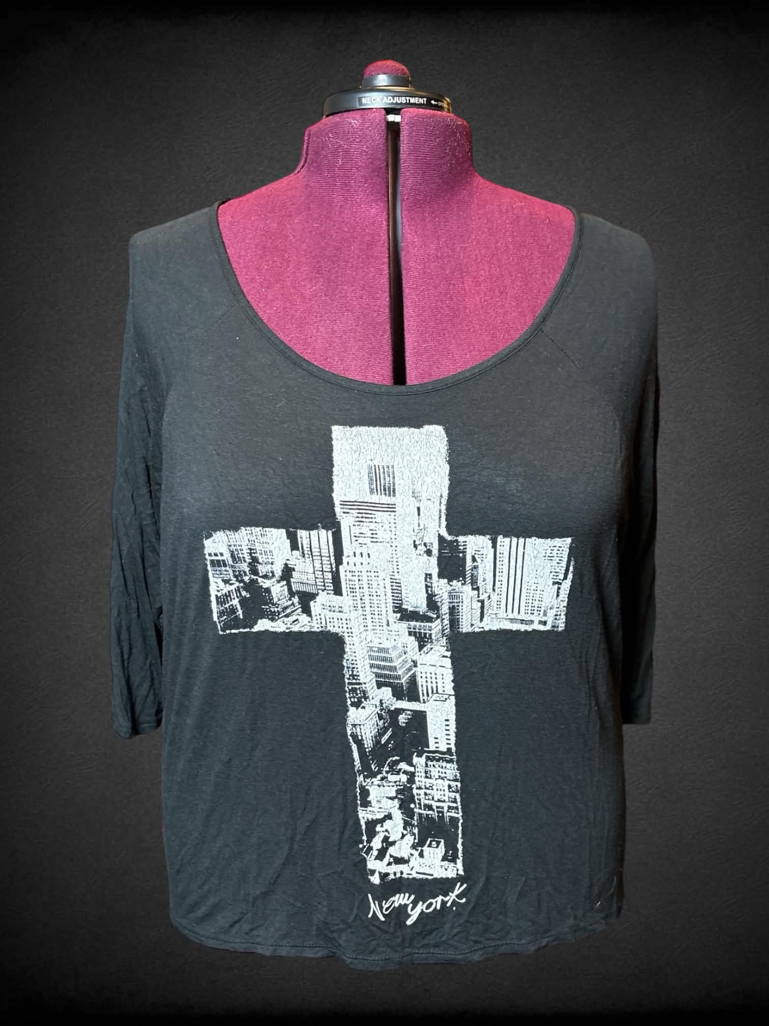 2X Caren Sport black t shirt with white crosses on back, and white New York cross on front