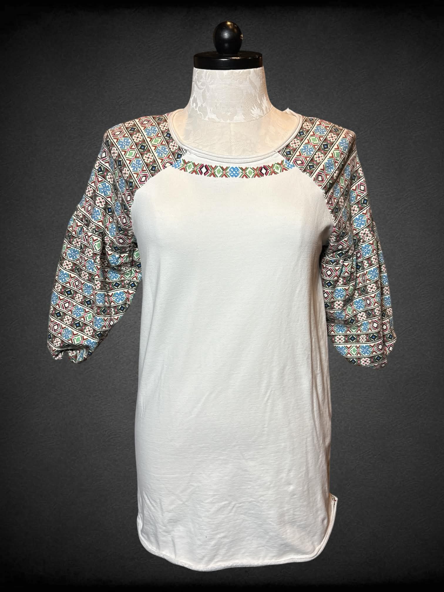 2X Laia white half balloon sleeves with multicolor geometric designs on sleeves