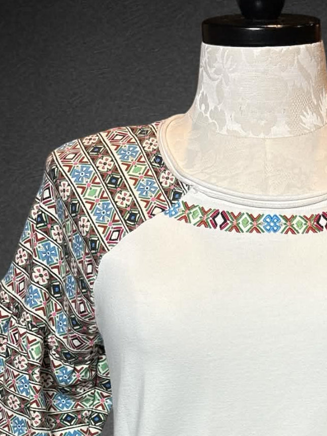 2X Laia white half balloon sleeves with multicolor geometric designs on sleeves