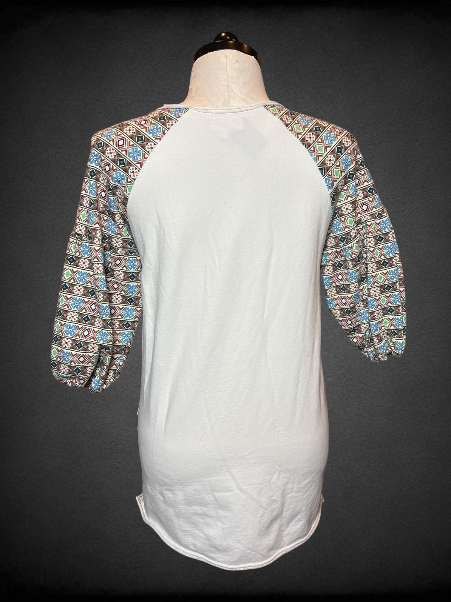 2X Laia white half balloon sleeves with multicolor geometric designs on sleeves