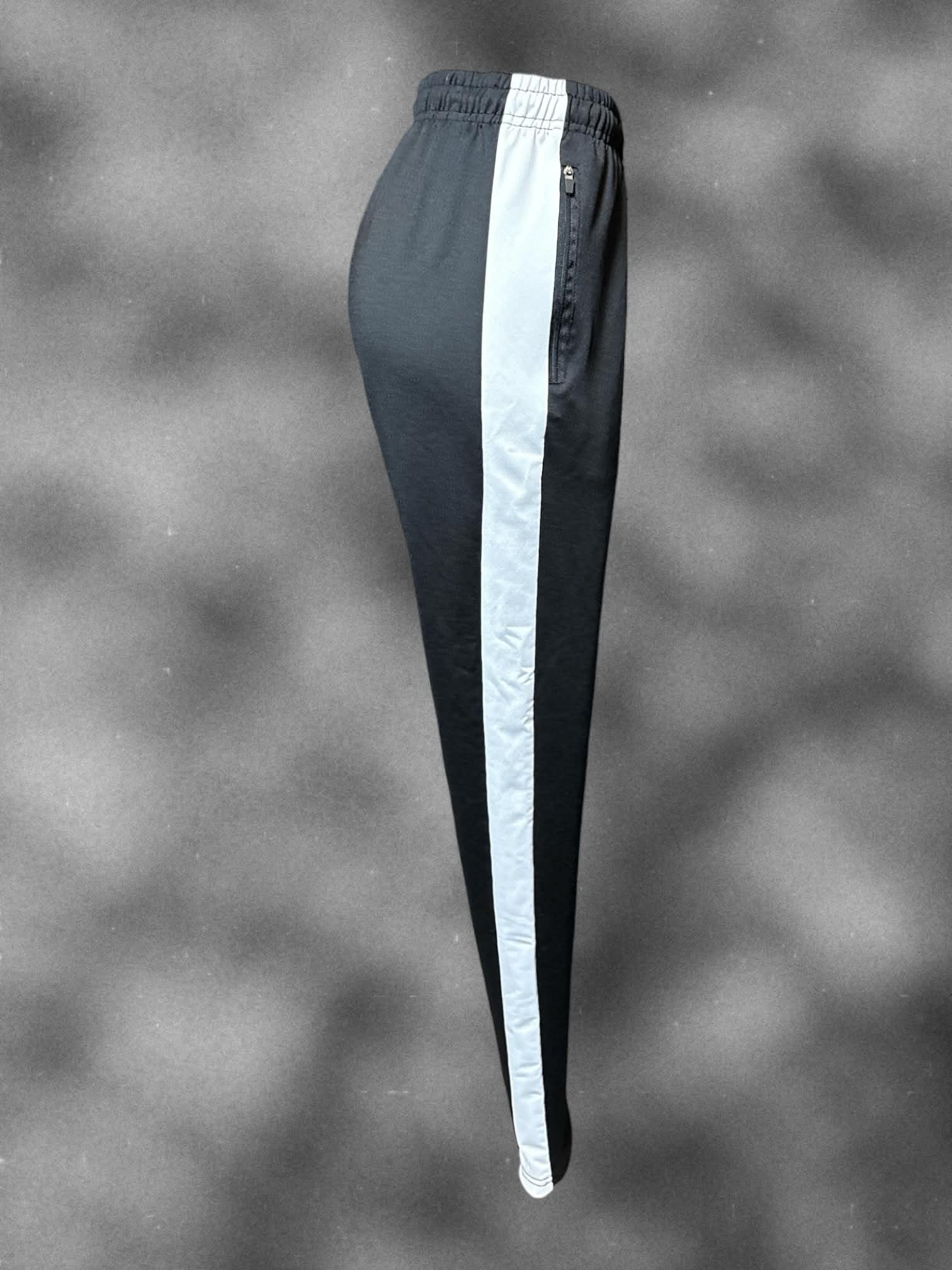 L Black pants with white stripes on sides, drawstring, and zipper pockets